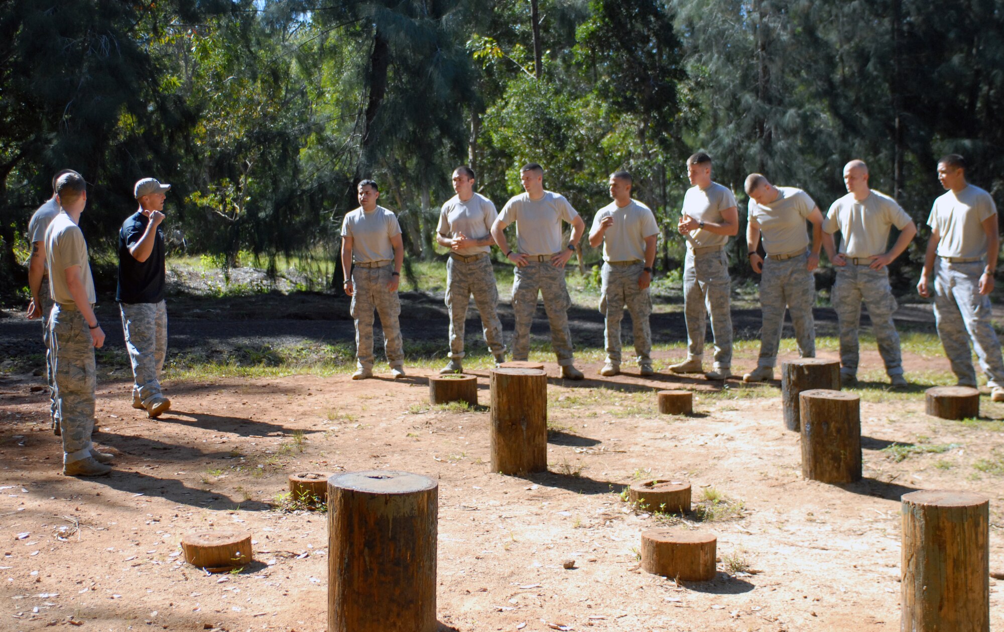Twelve 647th Security Forces Squadron Airmen from Joint Base Pearl Harbor-Hickam, Hawaii, prepare to complete an obstacle course owned by Schofield Barracks during try-outs for the Army Air Assault Course Feb. 1, 2011, in Wahiawa, Hawaii. A total of 16 security forces members are scheduled to attend the two-week Air Assault Course beginning May 5, 2011. These try-outs will help the Air Force security forces NCO in charge of training determine which Airmen he will send to this challenging course. (U.S. Air Force photo/Staff Sgt. Carolyn Viss)