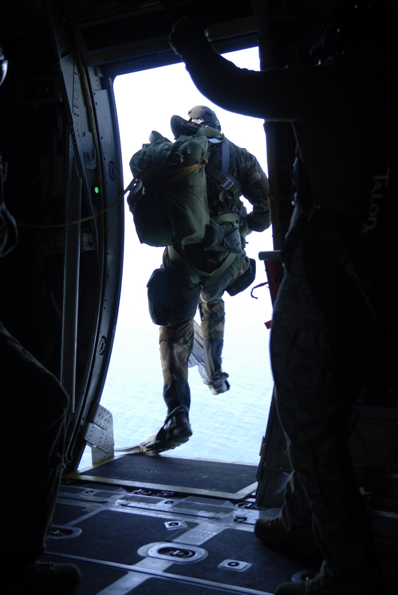 VANDENBERG AIR FORCE BASE, Calif. -- A pararescueman from the 31st Rescue Squadron, Kadena Air Base, Japan, jumps during a rescue jump master course here Tuesday, Feb. 1, 2011.  The pararescuemen trained by jumping toward a target in the water.  (U.S. Air Force photo/Senior Airman Andrew Satran) 

     
 
  