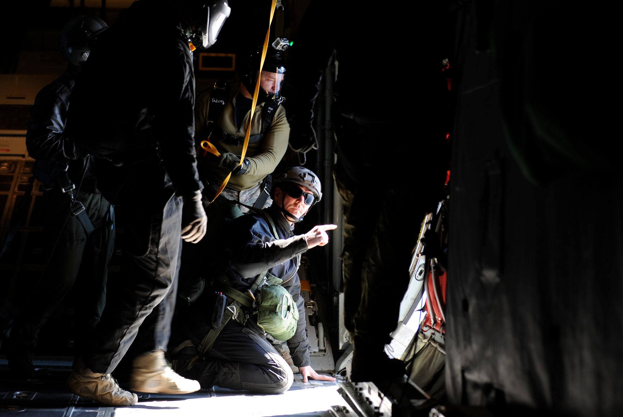 VANDENBERG AIR FORCE BASE, Calif. -- Preparing to jump, a pararescueman from the 131st Rescue Squadron, Moffett Field, Calif., shows his instructors the landing target during a rescue jump master course here Tuesday, Feb. 1, 2011.  The pararescuemen came to Vandenbergl from bases all over the world for tactical jump training.  (U.S. Air Force photo/Senior Airman Andrew Satran) 

   
 
  
