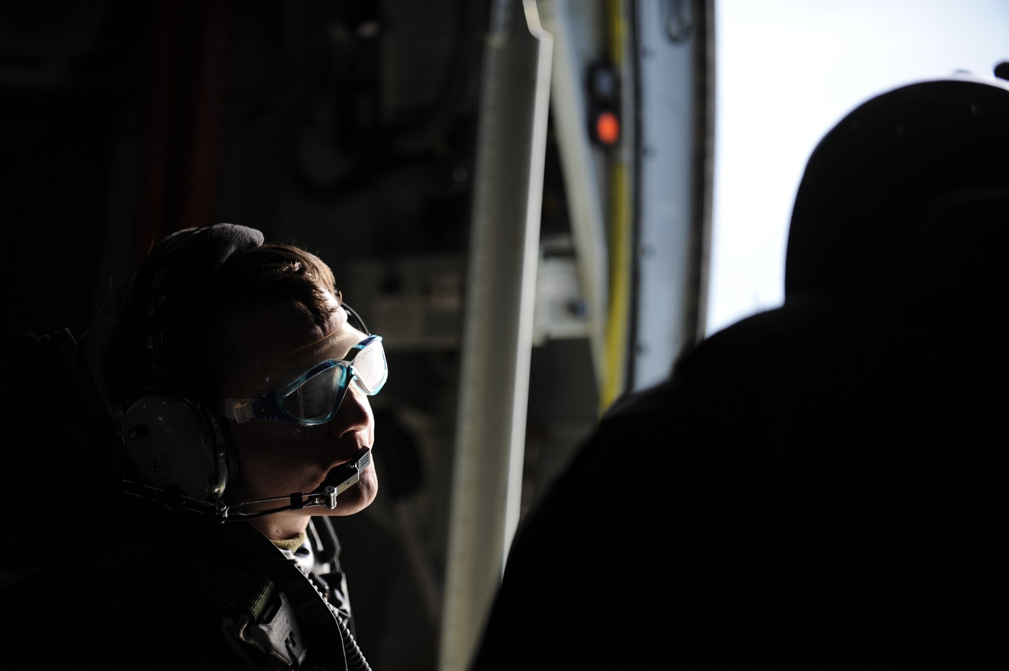 VANDENBERG AIR FORCE BASE, Calif. -- A pararescueman from the 31st Rescue Squadron, Kadena Air Base, Japan, speaks with an instructor before jumping during a rescue jump master course here Tuesday, Feb. 1, 2011.  The pararescuemen came to Vandenbergl from bases all over the world for tactical jump training.  (U.S. Air Force photo/Senior Airman Andrew Satran) 

 
 
  