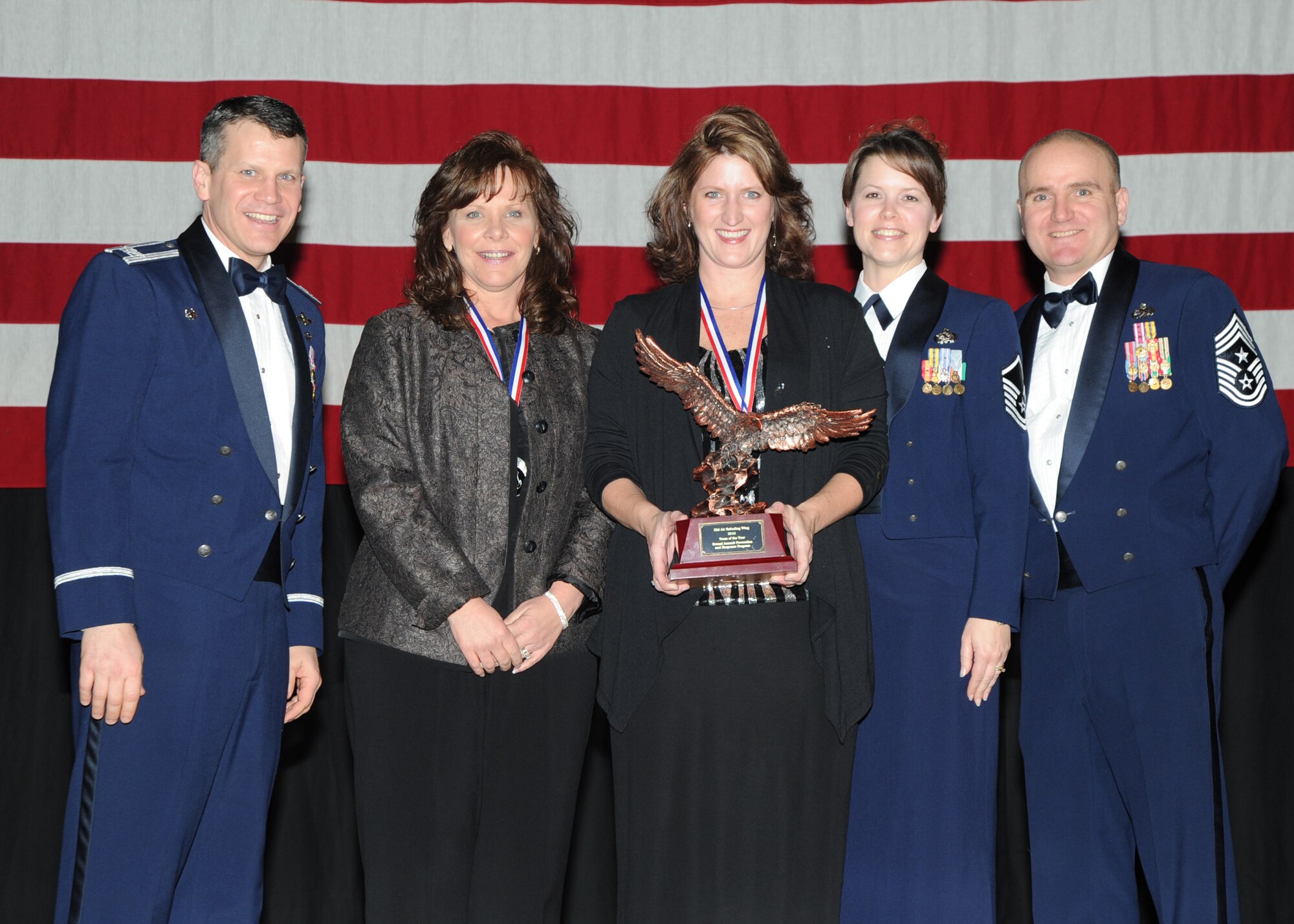 McConnell’s Sexual Assault Prevention and Response Team is given the 2010 Team of the Year award during the annual awards ceremony held in the Robert J. Dole Community Center ballroom, Jan. 28, 2011, McConnell Air Force Base, Kan. (U.S. Air Force photo/Airman 1st Class Katrina M. Brisbin)