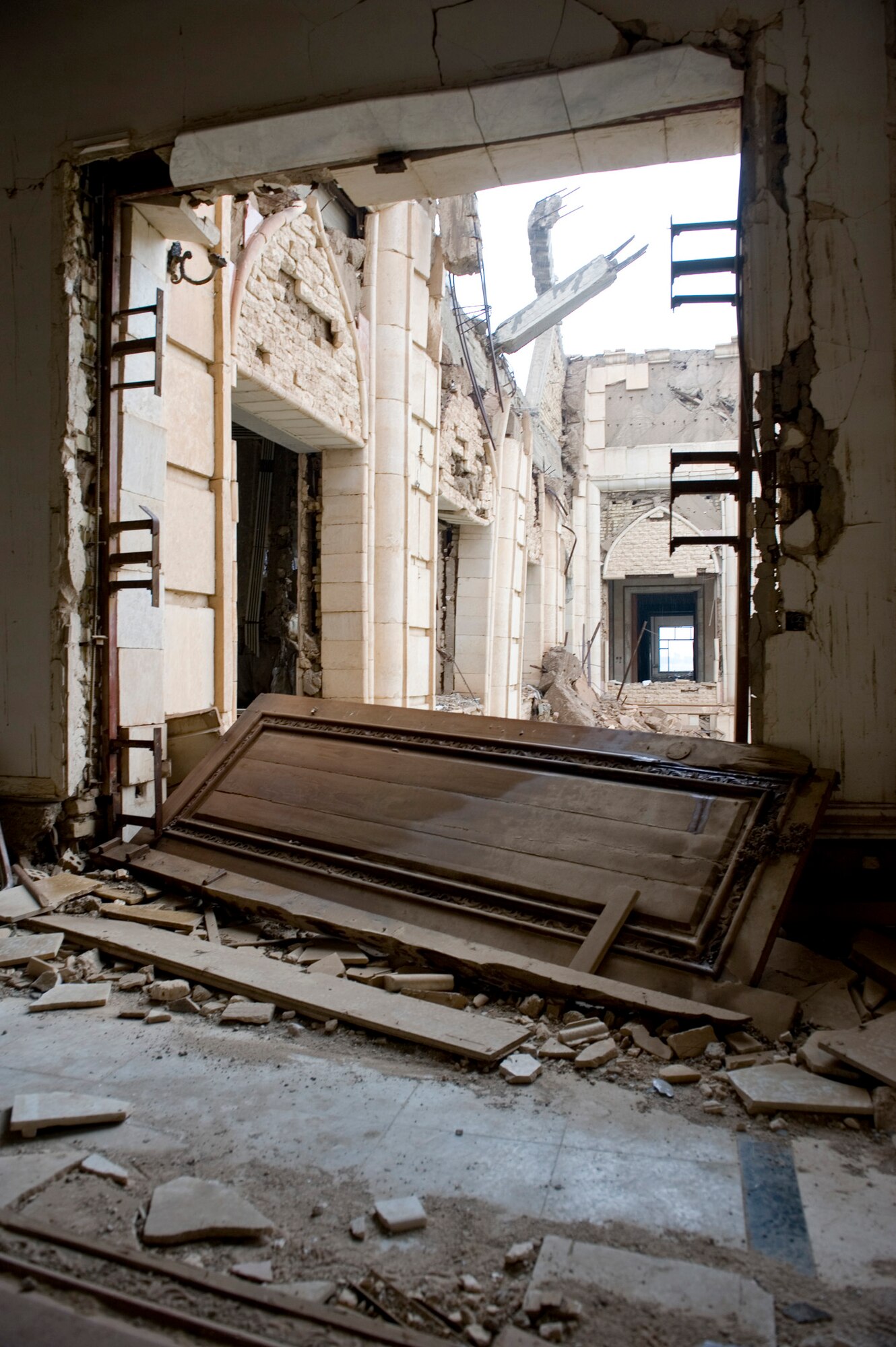 The remnants of the Baath Party House lie in disarray Jan. 29, 2011, in Baghdad, Iraq. The house was one of the first buildings hit during Operation Iraqi Freedom because intelligence sources believed Saddam Hussein was watching a movie here at the time. (U.S. Air Force photo/Staff Sgt. Levi Riendeau)