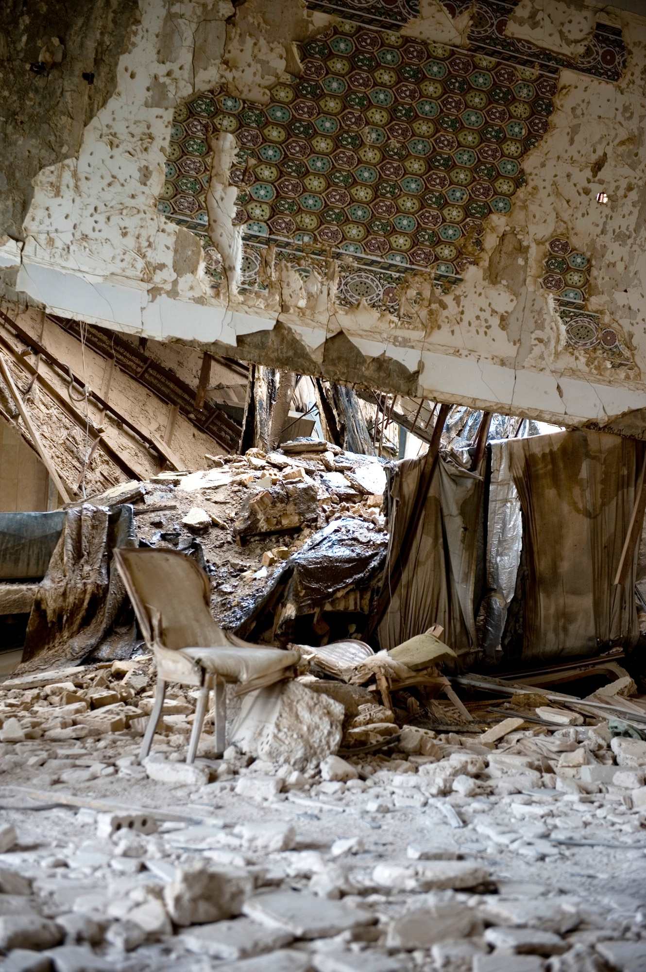 The remnants of the Baath Party House lie in disarray Jan. 29, 2011, in Baghdad, Iraq. The house was one of the first buildings hit during Operation Iraqi Freedom because intelligence sources believed Saddam Hussein was watching a movie here at the time. (U.S. Air Force photo/Staff Sgt. Levi Riendeau) 