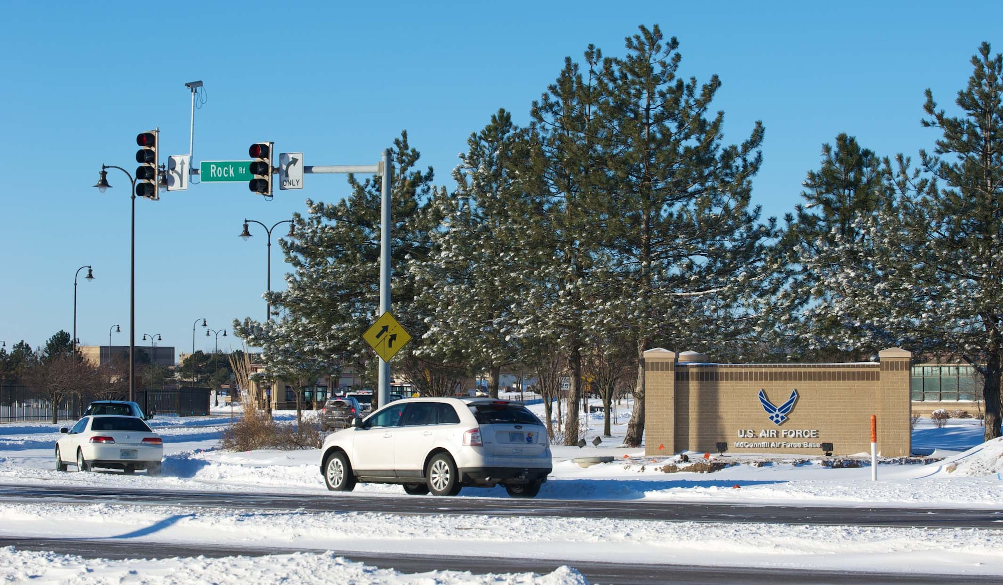 McConnell members maneuver through accumulated snow Feb. 2, 2011, McConnell Air Force Base, Kan.  Dozens of motorists in and around Wichita, Kan., found themselves stuck in the snow. (U.S. Air Force photo/Staff Sgt. Michael Schocker)