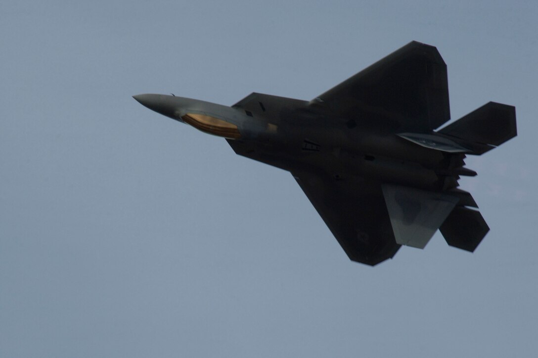 LANGLEY AIR FORCE BASE, Va. – Maj. Henry Schantz, Air Combat Command F-22 Demonstration Team pilot, showcases the aircraft’s combination of stealth and maneuverability Feb. 2, during an annual ACC certification. Along with the sleek aerodynamic design, the F-22 engine produces more thrust than other current fighter engine. (U.S. Air Force photo/Airman 1st Class Racheal Watson)(RELEASED)