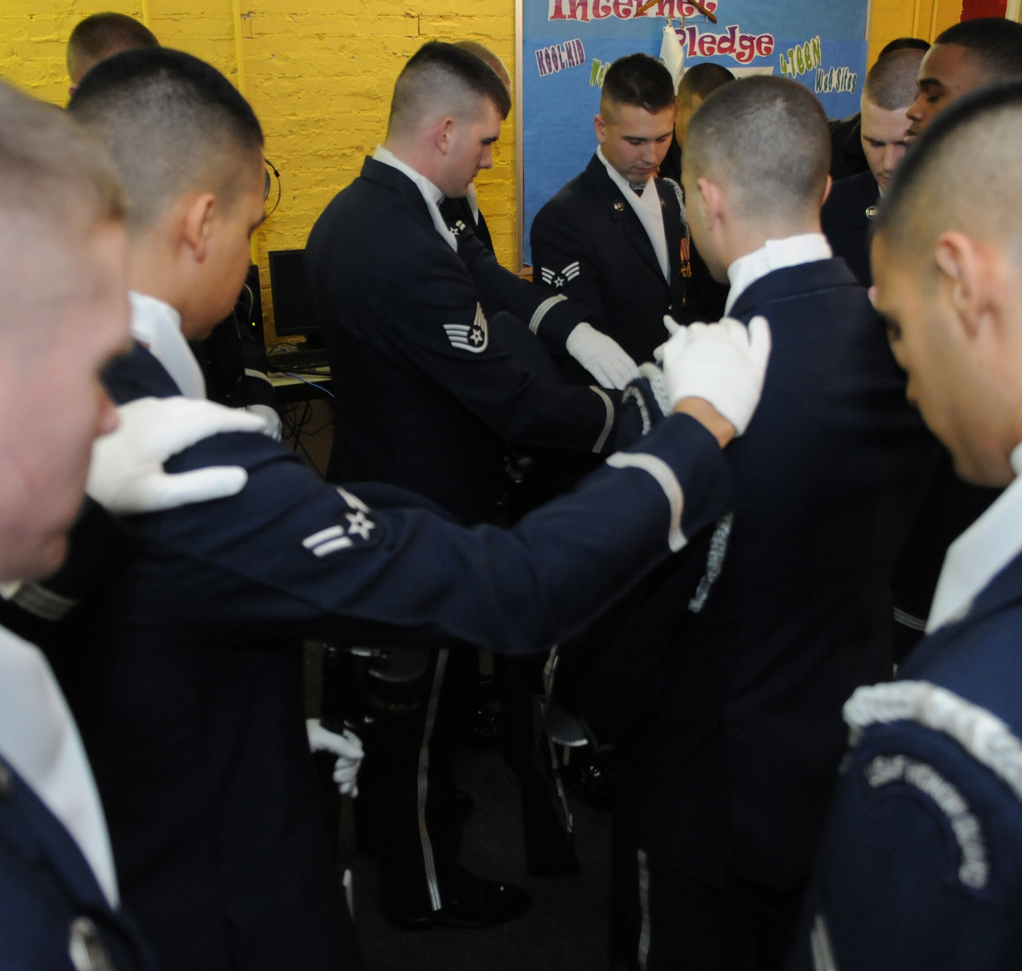 The U.S. Air Force Honor Guard drill team joins in prayer before the performance Jan. 21 at the Boys and Girls Club of D.C., Washington D.C. The prayer brings the team together to motive them before the performance. (U.S. Air Force photo by Senior Airman Christopher Ruano)