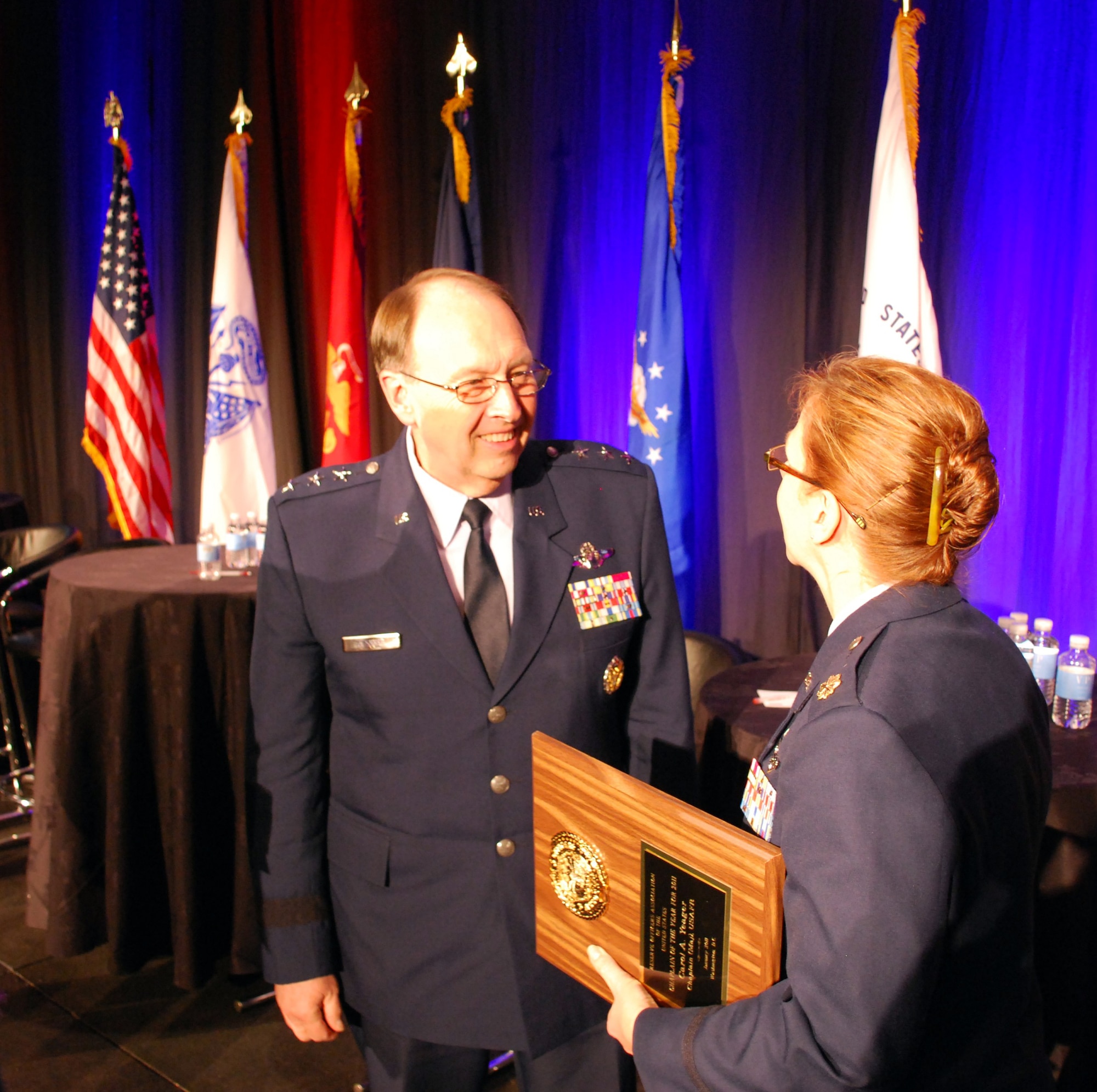 Lt. Gen. Charles E. Stenner Jr., congratulates Chaplain (Maj.) Carol A. Yeager, the Reserve Officer Association Chaplain of the Year for 2010 during the ROA National Security Symposium in Washington, D.C., on Jan. 31, 2011. General Stenner, chief of the Air Force Reserve, and commander of Air Force Reserve Command, told the crowd gathered at the ROA symposium that the efficiency and cost-effectiveness of the Air Force Reserve is being discussed by the highest levels of leadership as they re-balance regular and reserve component structures. (U.S. Air Force photo/Col. Bob Thompson)