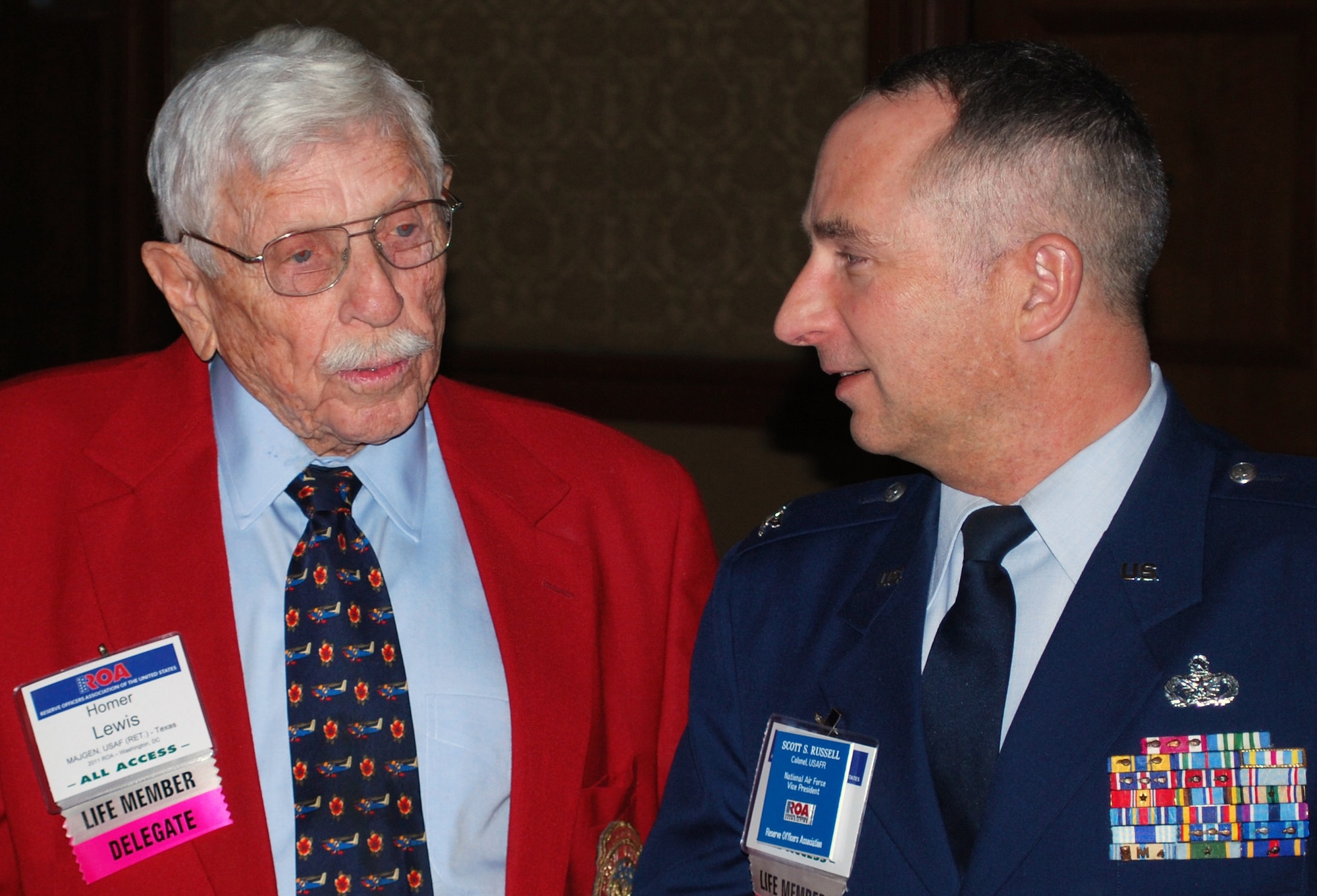 Retired Air Force Maj. Gen. Homer I. Lewis philosophizes with Col. Scott S. Russell, ROA's National Air Force vice president at the ROA National Security Symposium in Washington, D.C., Jan. 31, 2011.  General Lewis, 90, and a World War II veteran, served as the chief of the Air Force Reserve from 1971 to 1975 and is a past president of the ROA. (U.S. Air Force photo/Col. Bob Thompson)