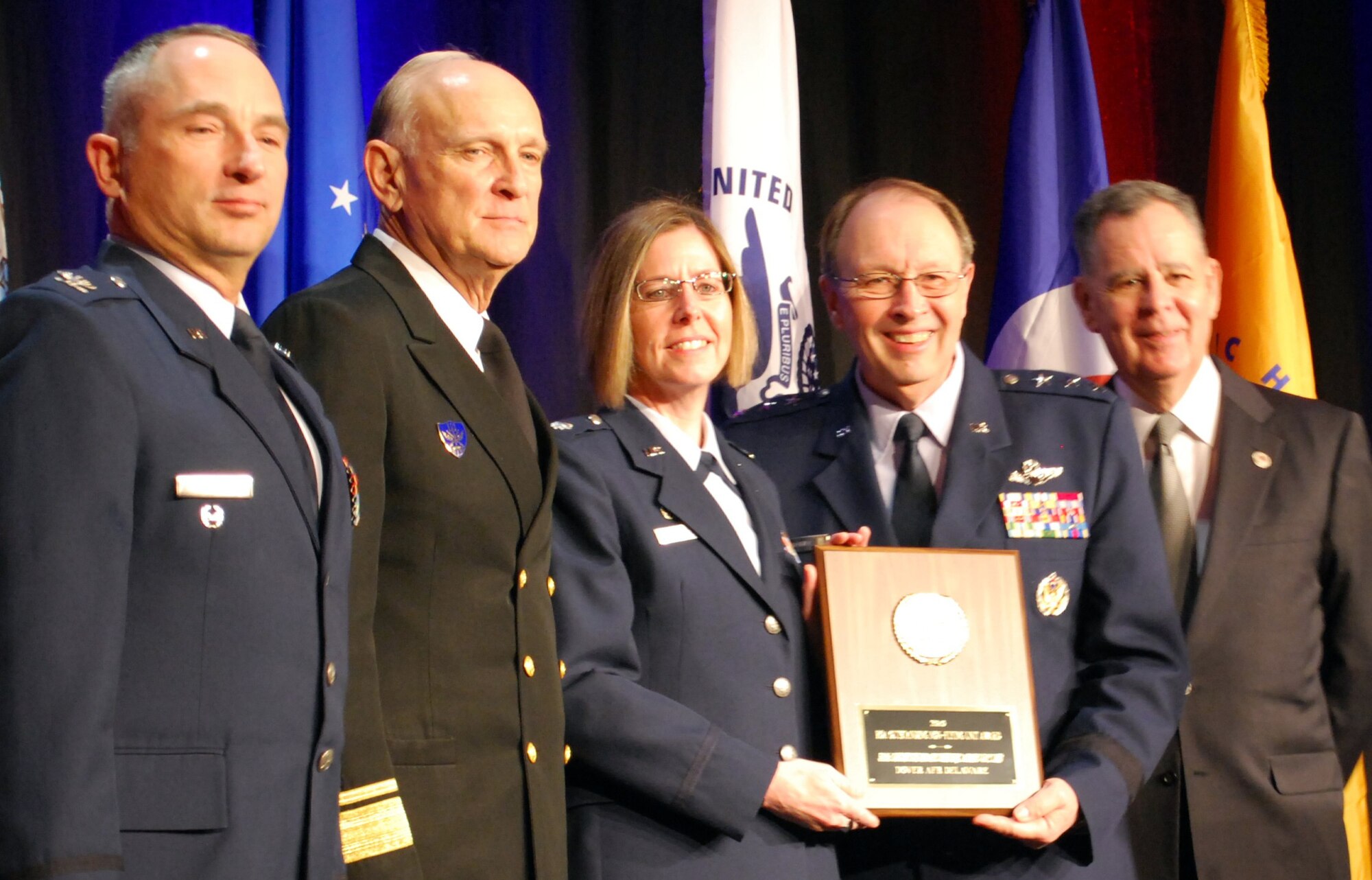 Lt. Col. Gretchen Wiltse, 512th Logistics Readiness Squadron commander, Dover Air Force Base, Del., accepts the Reserve Officer Association's Outstanding Non-Flying Unit Award at the ROA National Security Symposium in Washington, D.C., Jan. 31, 2011. From left, Col. Scott S. Russell, ROA's National Air Force vice president; retired Rear Adm. Paul T. Kayye, USN and ROA's national president; Colonel Wiltse; Lt. Gen. Charles E. Stenner Jr., chief of the Air Force Reserve and commander of Air Force Reserve Command; Dennis M. McCarthy, assistant secretary of Defense for Reserve Affairs. (U.S. Air Force photo/Col. Bob Thompson)