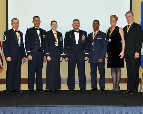 Col. Edward McKinzie, 505th Command and Control Wing commander, (center) poses with the wing's 2010 annual awards winners during a ceremony Feb. 2 at Hurlburt Field, Fla. Pictured (left to right) are: Senior NCO of the Year Master Sgt. Jason Ackerman, Company Grade Officer of the Year Capt. Todd Dawson, Field Grade Officer of the Year Maj. Heather Baldwin, Colonel McKinzie, Airman of the Year Senior Amn. Stephan Deloach, Civilian Technician of the Year Jasmine Lawson and Civilian Manager of the Year Laurence Clark. The wing has several geographically separated units and several of the winners were unable to attend due to severe weather affecting much of the United States. (U.S. Air Force photo/Keith Keel)