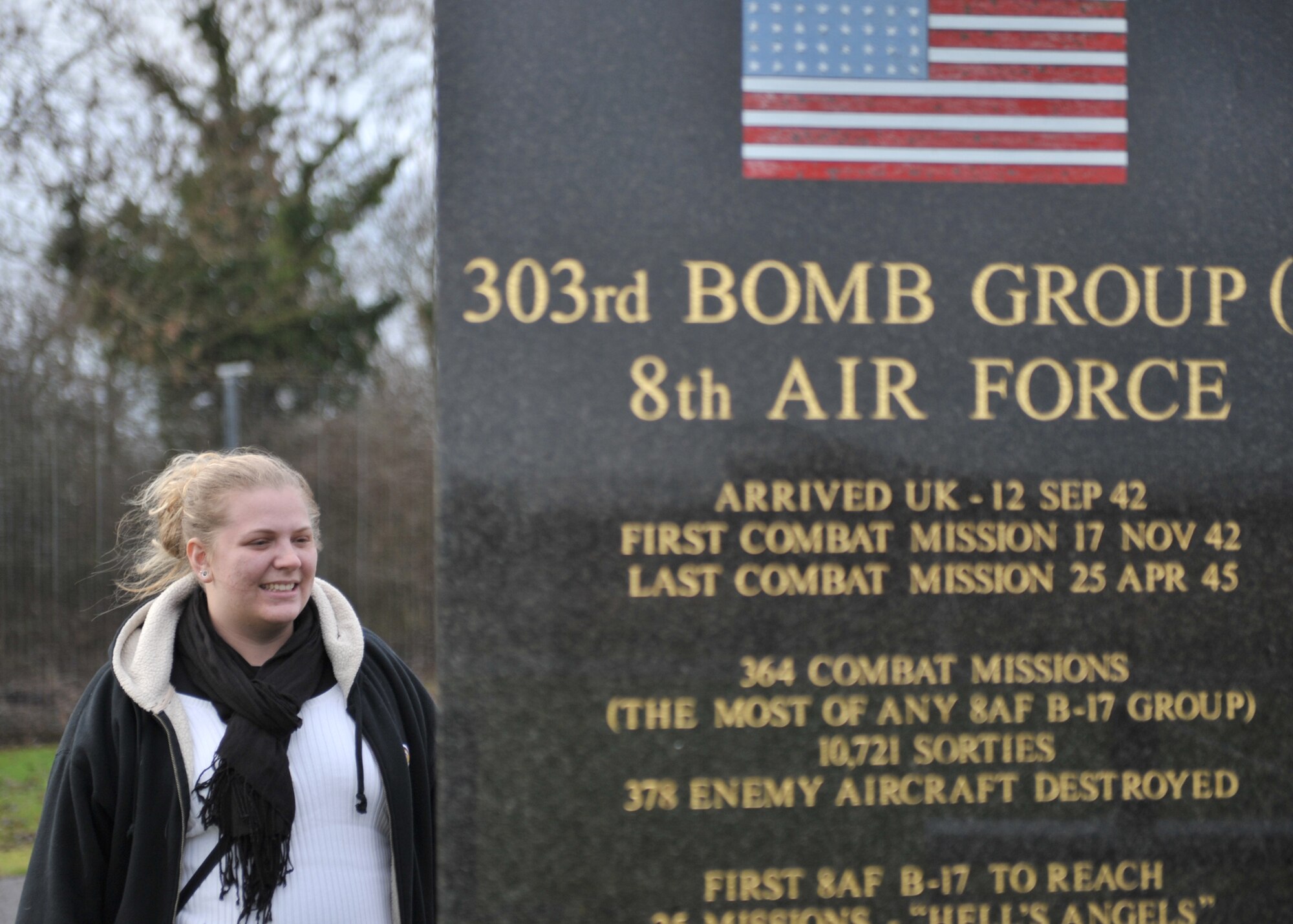 Ms. Teddi Gobrecht stands at the 303rd Bomb Group (Heavy) Memorial at RAF Molesworth.  Ms. Gobrecht visited the base where her grandfather Lt Col Harry Gobreacht flew B-17s during the Second World War on Janaury 25, 2011. (U.S. Air Force photo by Staff Sgt. Javier Cruz)