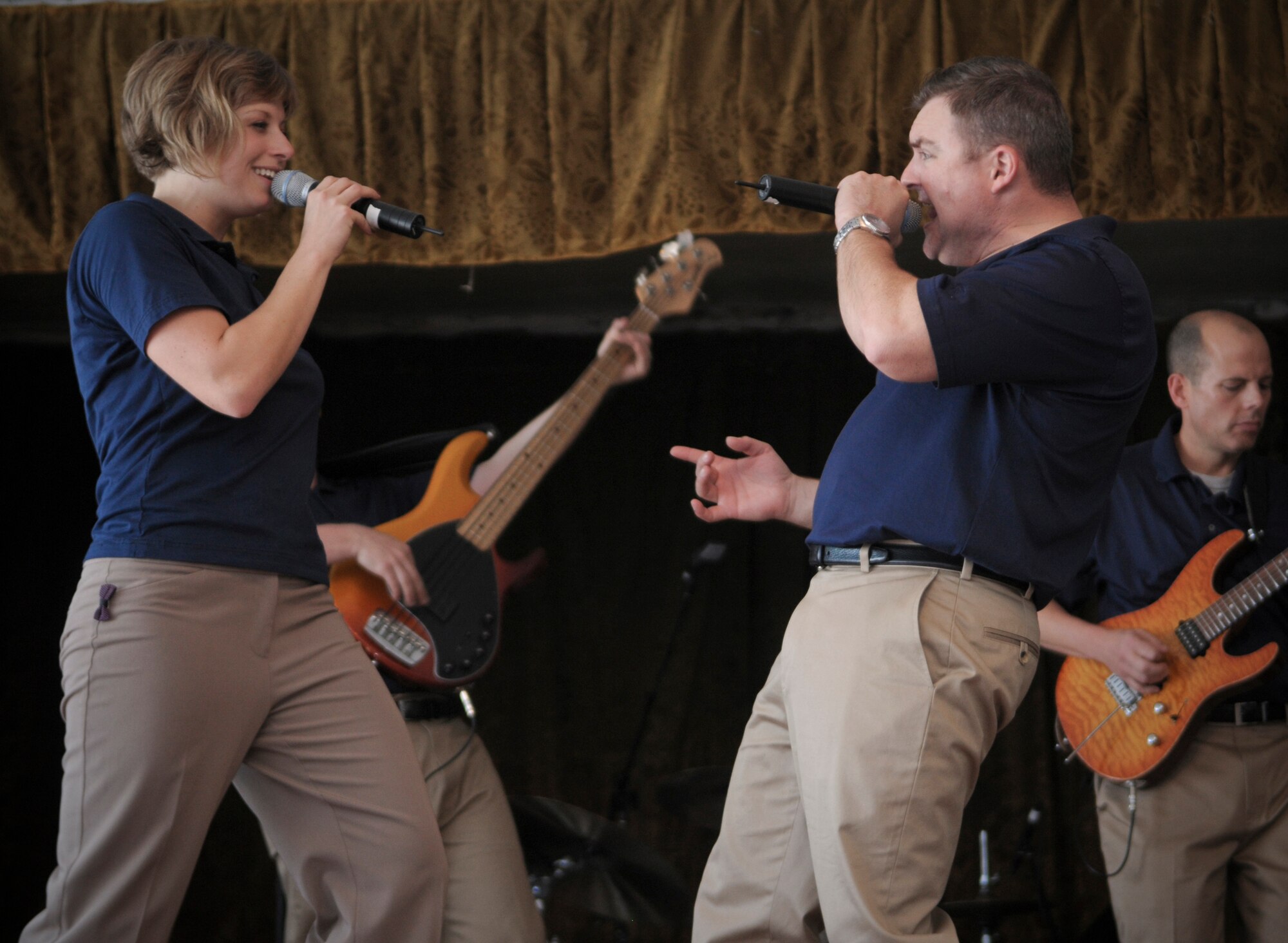 BISHKEK, Kyrgyzstan --  Airman 1st Class Carmen Emborski, and Tech. Sgt. Jamie Gilley U.S. Air Forces Central "Startlifter" band vocalists, perform at Karabalta School -- a local grade school, 29 Jan. The Starlifter band performed a wide variety of music for the students and teachers to enjoy. (U.S. Air Force photo/Staff Sgt. Stacy Moless)