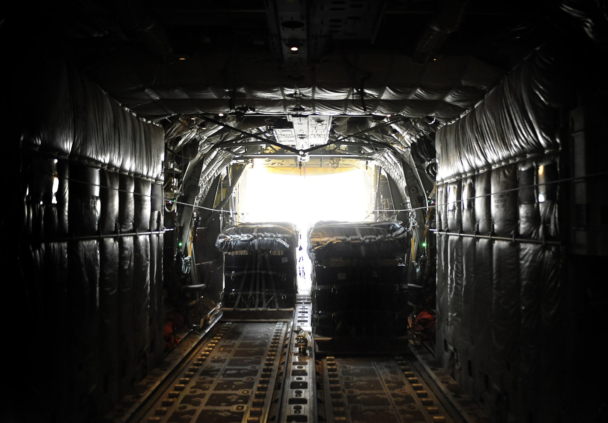 A C-130J Hercules from the 772nd Expeditionary Airlift Squadron releases bundles for a remote forward operating base in Afghanistan during an airdrop mission Feb. 2, 2011. During the month of January, the 772nd Expeditionary Airlift Squadron broke a record by completing 51 airdrop missions and dropping more than 1.1 million pounds of supplies during a one-month period. (U.S. Air Force photo/Senior Airman Willard E. Grande II/Released)
