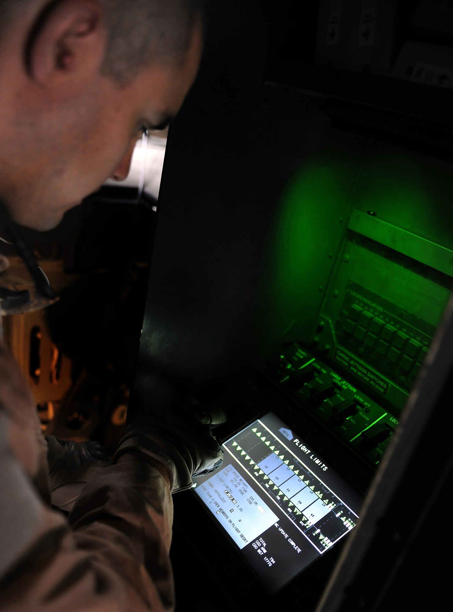 Tech. Sgt. Josh Romero inputs the weight of oncoming cargo Feb. 2, 2011, at Kandahar Airfield, Afghanistan. During the month of January, the 772nd Expeditionary Airlift Squadron broke a record by completing 51 airdrop missions and dropping more than 1.1 million pounds of supplies during a one-month period. Sergeant Romero is a loadmaster assigned to the 772nd EAS. (U.S. Air Force photo/Senior Airman Willard E. Grande II/Released)