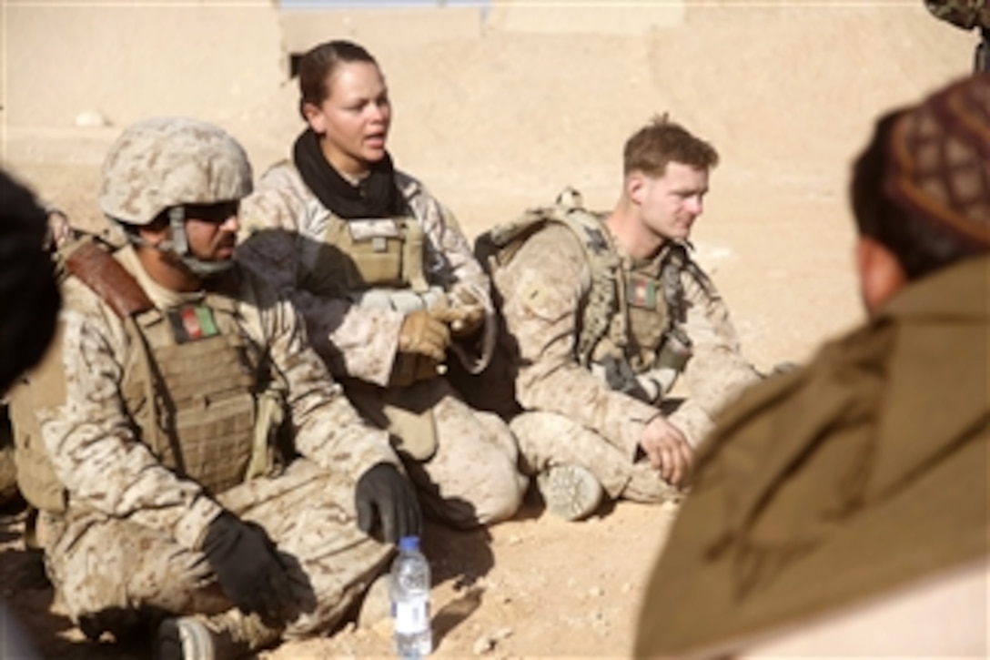 U.S. Marine Corps Sgt. Miranda Mcclain (2nd from left), with a female engagement team attached to Lima Company, 3rd Battalion, 5th Marine Regiment, Regimental Combat Team 2, speaks during a shura, or meeting, in Sangin district, Helmand province, Afghanistan, on Jan. 21, 2011.  Marines conducted weekly shuras to convey the company's intent and gain the trust of area residents.  