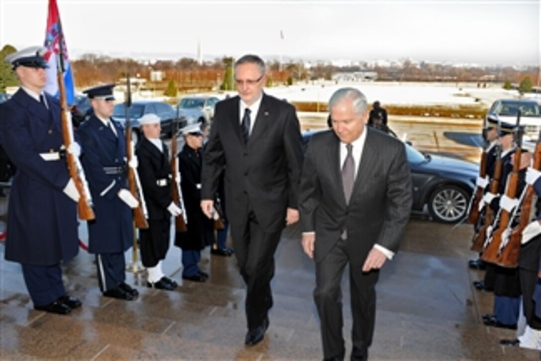 Secretary of Defense Robert M. Gates (right) escorts Croatian Defense Minister Davor Bozinovic (left) through an honor cordon and into the Pentagon on Feb. 2, 2011.  Gates and Bozinovic will conduct bilateral security discussions on a wide range of issues.  