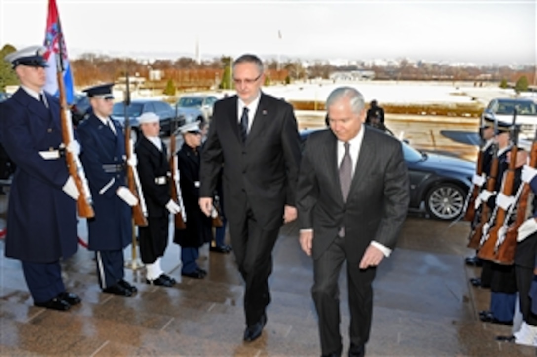 Secretary of Defense Robert M. Gates (right) escorts Croatian Defense Minister Davor Bozinovic (left) through an honor cordon and into the Pentagon on Feb. 2, 2011.  Gates and Bozinovic will conduct bilateral security discussions on a wide range of issues.  