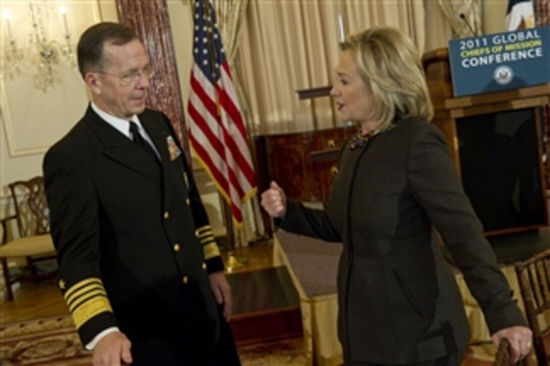 Chairman of the Joint Chiefs of Staff Adm. Mike Mullen, U.S. Navy, speaks with Secretary of State Hillary Clinton prior to delivering remarks at the Annual Chiefs of Mission Conference at the Department of State in Washington, D.C., on Feb. 2, 2011.  