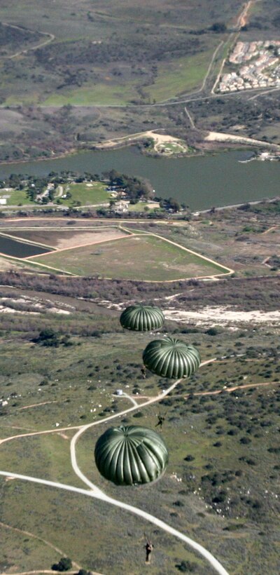 Marines from 1st Radio Battalion soar over Marine Corps Base Camp Pendleton Feb. 3. Marine Heavy Helicopter Squadron 465 flew the parachutists for a parachute training operation.