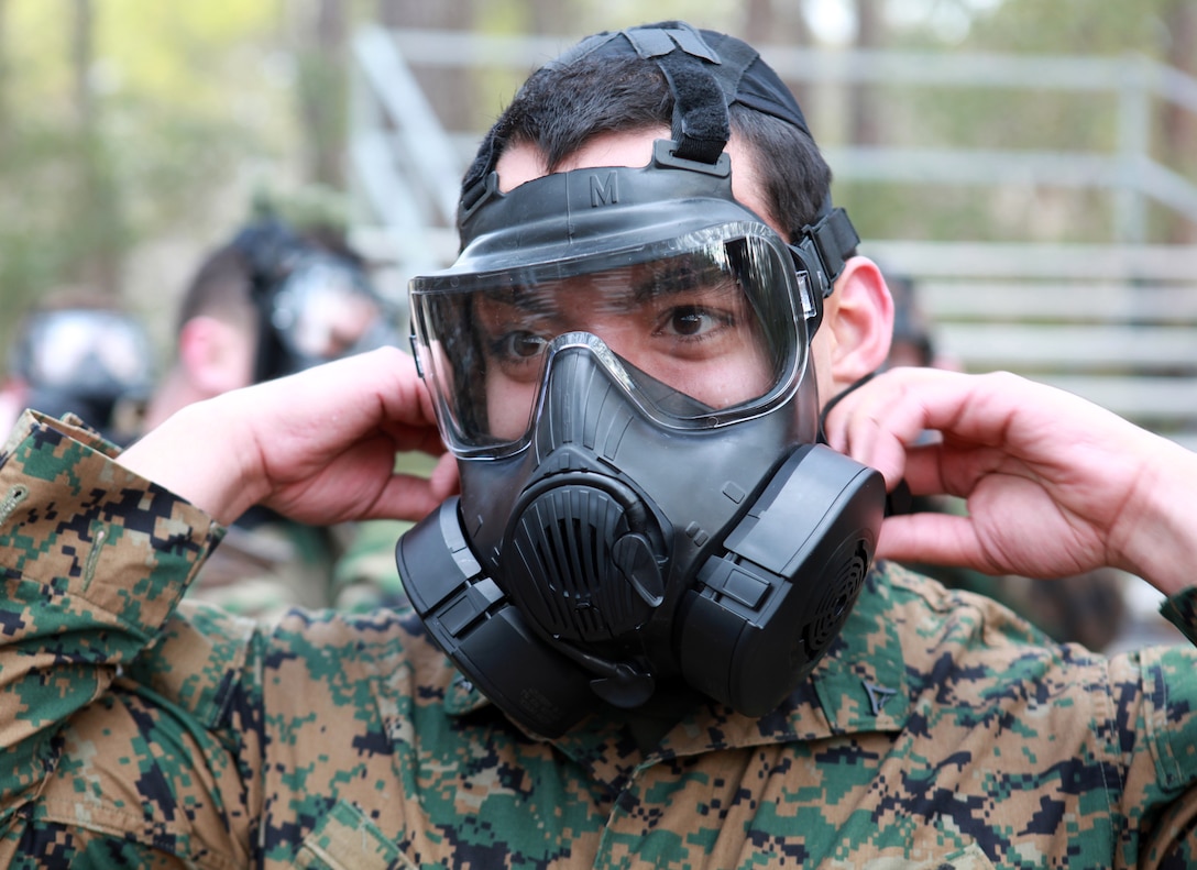 Lance Cpl. Noah Koehl, administration clerk with the 24th Marine Expeditionary Unit, clears his M50 Joint Service General Purpose Gas Mask during annual chemical, biological, radiological and nuclear defense training at the Marine Corps Base Gas Chamber on Camp Lejeune, N.C. Feb. 3. Marines with the 24th MEU trained on the new M50 JSGPM, M50 Joint Service General Purpose Gas Masks, which has been phasing out the 1980s-era M40 Field Protective Mask across the Marine Corps since September 2009.