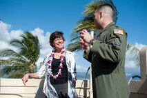 Capt. John Cortney, 15th Operations Support Squadron C-17 Instructor Pilot, talks with Mrs. Lorrie Kresge about 15th Wing history from the "Crow's Nest" above the base operations building Feb. 3 at Joint Base Pearl Harbor Hickam, Hawaii. During her visit to base operations, Mrs. Kresge  was briefed on the building's history as well as its function within the wing. (U.S. Air Force photo by Staff Sgt. Nathan Allen)
