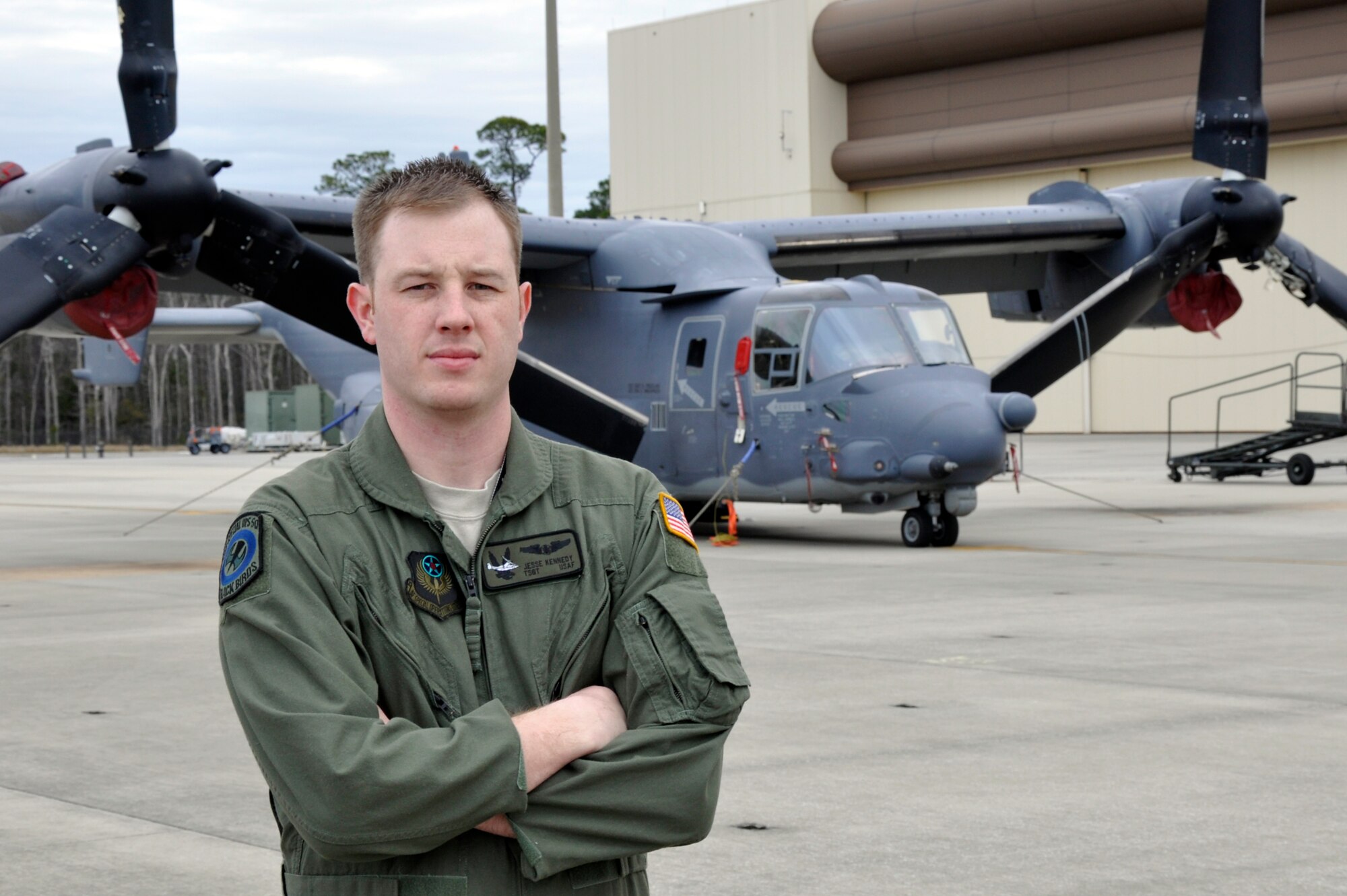 Tech. Sgt. Jesse Kennedy, 8th Special Operations Squadron CV-22 flight engineer and NCO in charge of mobility, poses in front of a CV-22 outside his squadron at Hurlburt Field, Fla., Feb. 3, 2011. Sergeant Kennedy was selected for this week's Tip of the Spear spotlight. (U.S. Air Force photo by Senior Airman Joe McFadden/RELEASED)

