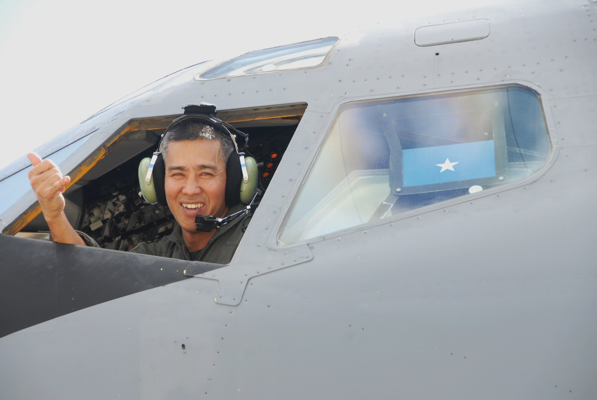 Brig. Gen. Joseph Kim, outgoing 154th Wing commander, bids aloha to his KC-135 piloting days during his final flight on Joint Base Pearl Harbor-Hickam, Hawaii, Feb. 3. Members of the 154th Wing and the active duty 15th Wing partnered together through total force integration to fly and maintain aircraft here. General Kim served in various positions within the 154th Wing, including plans, current operations, and Director of Operations before commanding the 203rd Air Refueling Squadron. He then served as Air Operations Officer, Deputy Commander and Commander, 154th Operations Group and 154th Wing Vice Commander and then 154th Wing Commander. He recently was appointed as the Deputy Adjutant General for the State of Hawaii. (U.S. Air Force Photo/Master Sgt. Kristen Stanley)