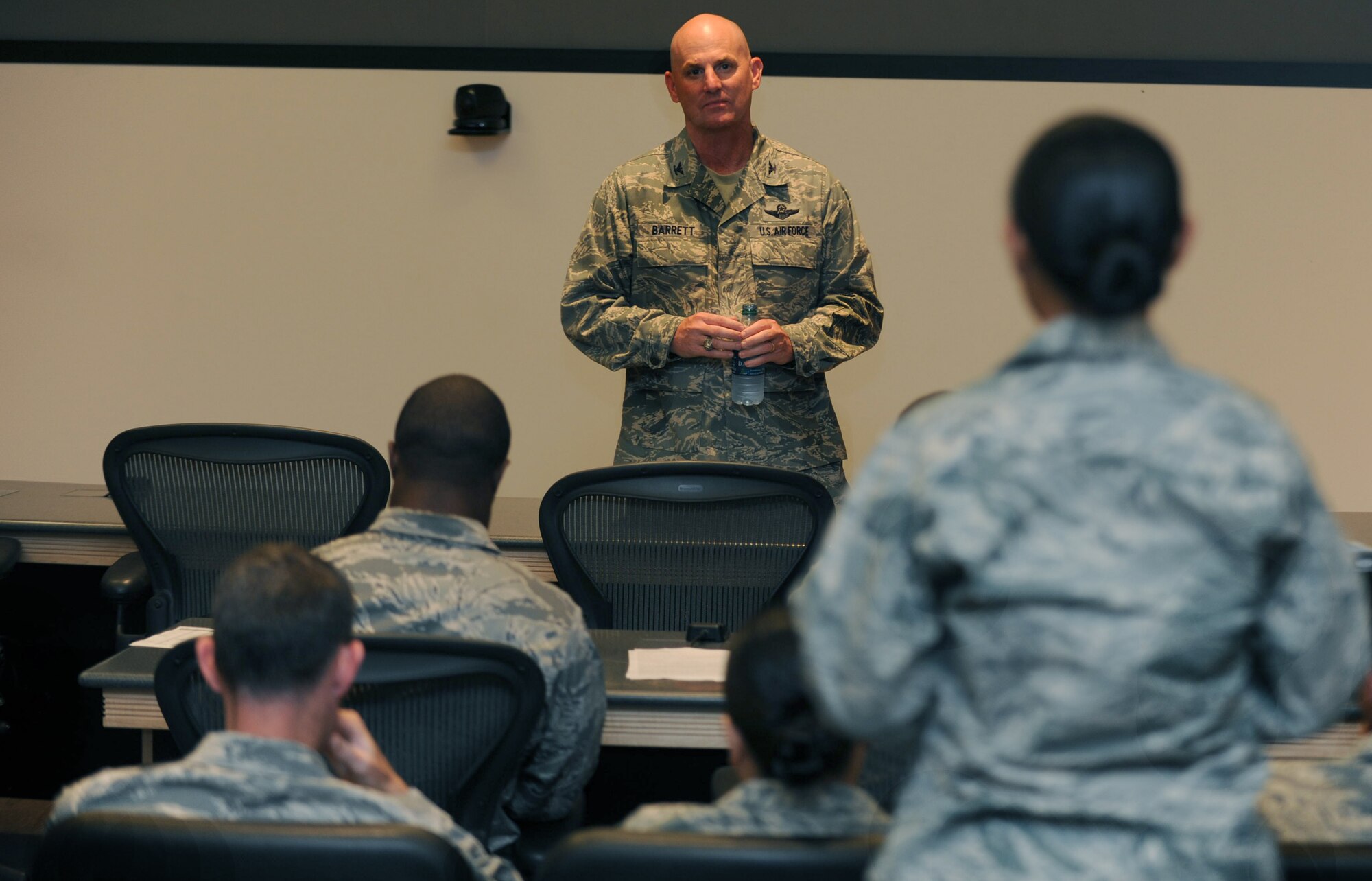 Col. Sam Barrett, 15th Wing commander, speaks to company grade officers at the Pacific Air Force Company Grade Officer Council Conference held Feb. 3 at the Aloha Conference Center on Joint Base Pearl Harbor-Hickam, Hawaii. Colonel Barrett is a key mentor for the Hickam CGOC. The CGOC conference is held to assist the shaping of future Air Force leadership and offer mentorship and guidance to young officers. (Air Force photo/Airman 1st Class Lauren Main)