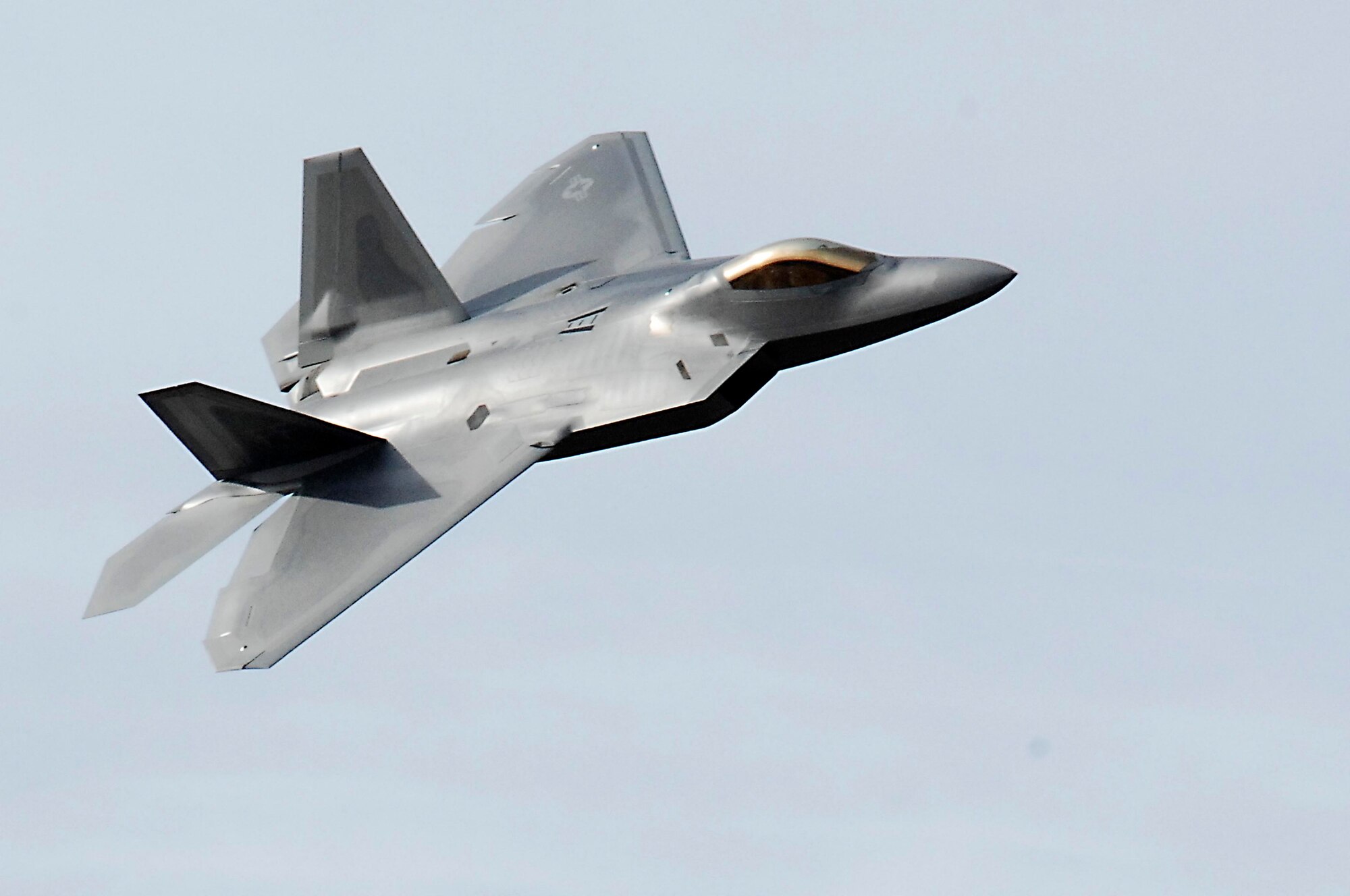 LANGLEY AIR FORCE BASE, Va.- Maj. Henry Schantz, F-22 Demonstration Team pilot, performs an aerial routine during the certification demo here Feb. 2 The A-10 East, Viper West Coast, and F-22 demonstration teams spent three days receiving their annual Air Combat Command certification.  (U.S. Air Force photo/Airman 1st Class Kayla Newman)(Released)