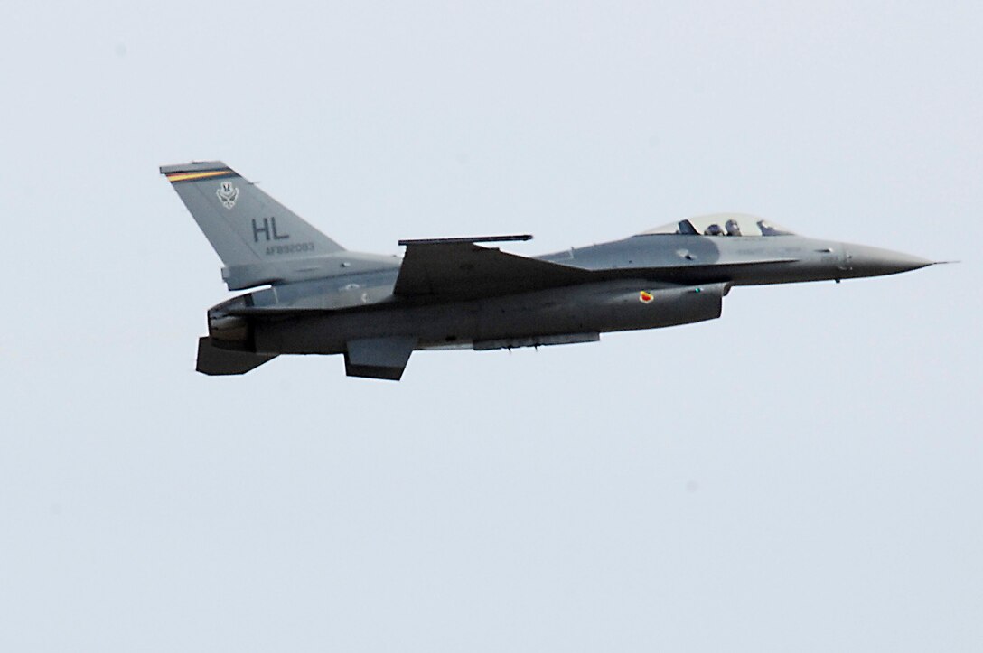 LANGLEY AIR FORCE BASE, Va.- Capt. Garrett Dover, F-16 Falcon pilot from Hill Air Force Base, Utah, soars during a demo certification Feb. 2.  The A-10 East, Viper West Coast, and F-22 demonstration teams spent three days receiving their annual Air Combat Command certification.  (U.S. Air Force photo/Airman 1st Class Kayla Newman)(Released)