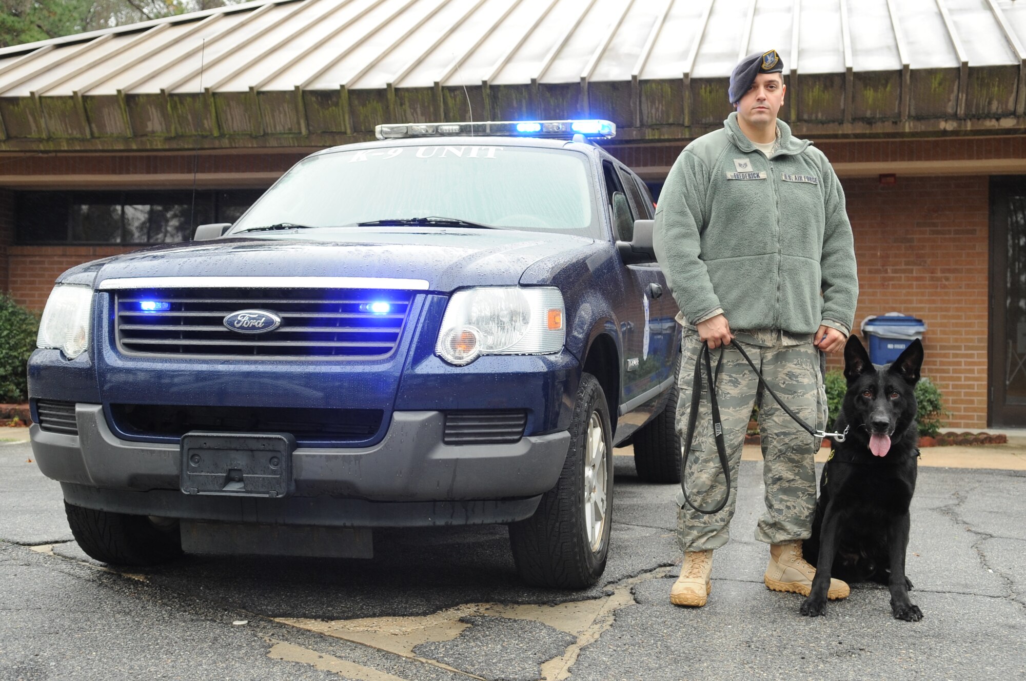 MOODY AIR FORCE BASE, Ga. -- Staff Sgt. Ryan Frederick, 23rd Security Forces Squadron military working dog handler, stands with his dog Ficko Feb. 4. Sergeant Frederick has only been working with Ficko for one month and they will deploy together this spring. (U.S. Air Force photo/Airman 1st Class Douglas Ellis)(RELEASED)
