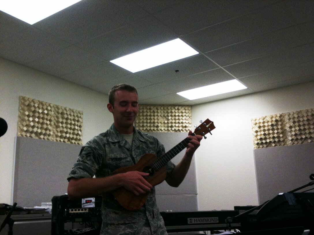 A1C Aaron Kusterer rehearses with Hana Hou. The newest member of the USAF Band of the Pacific- Hawaii, he'll be performing Guitar and Ukulele in Hana Hou and Small Kine.  (US Air Force Photo/ TSgt Joshua Fedele)