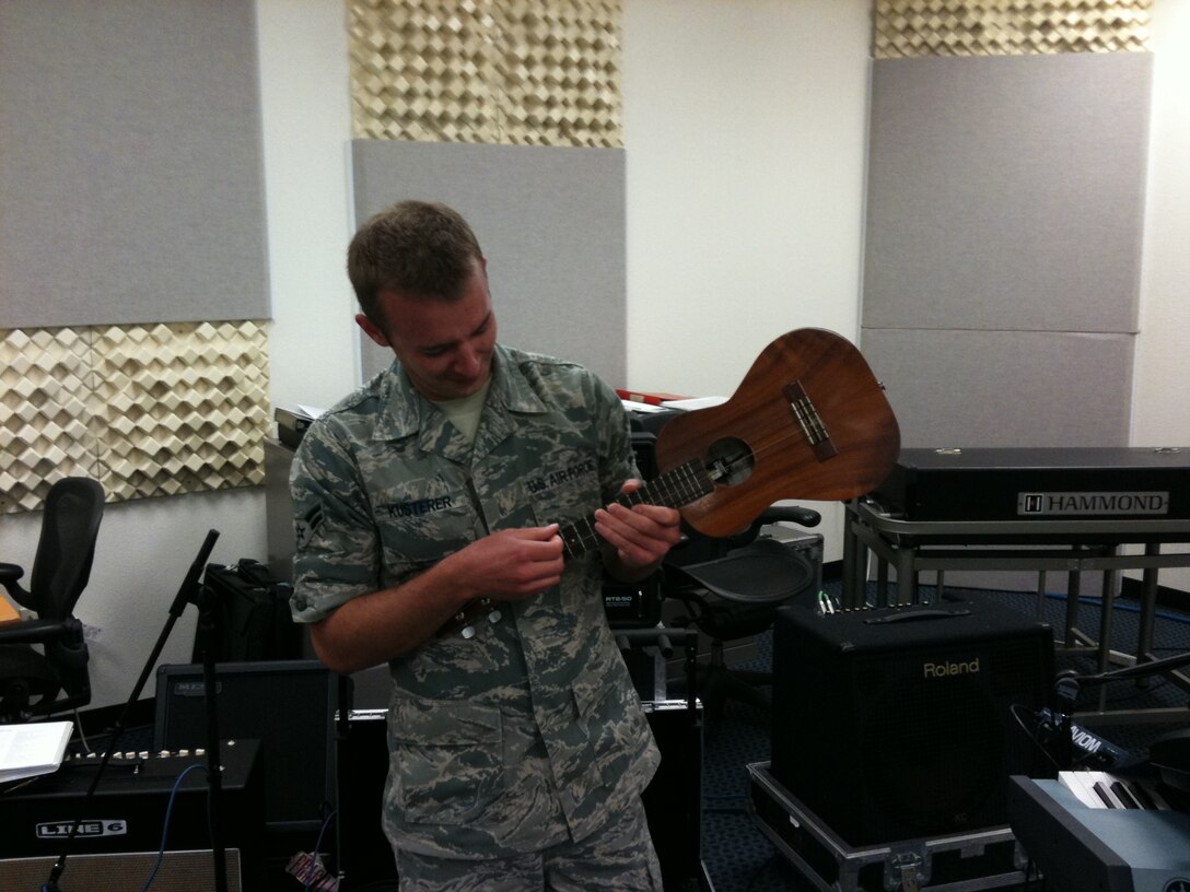 A1C Aaron Kusterer makes his first attempt at playing Hawaii's favorite instrument, the Ukulele.  The newest member of the USAF Band of the Pacific- Hawaii, he'll be performing guitar and Ukulele in Hana Hou and Small Kine.