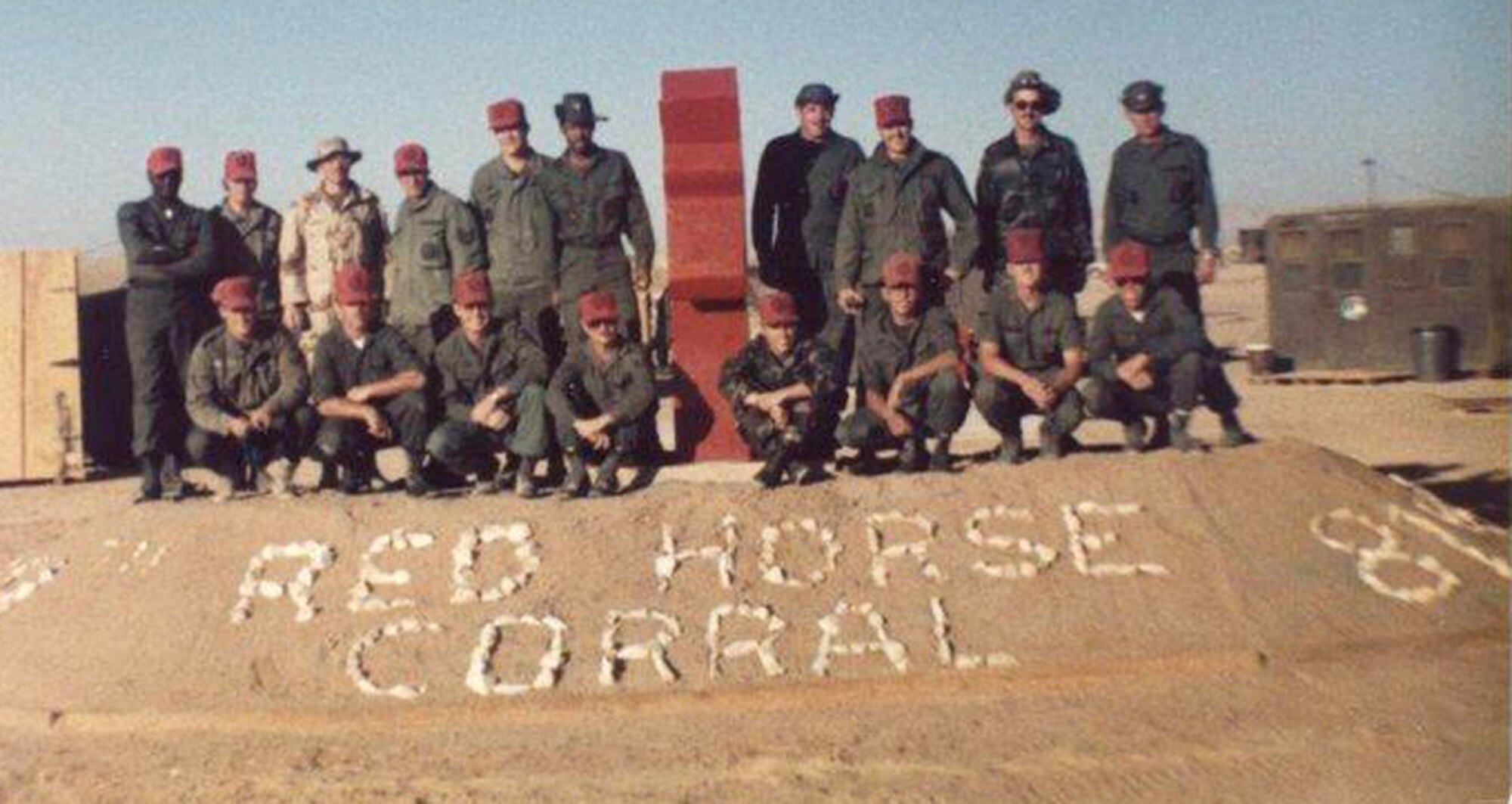 Members from the original 819th RED HORSE Squadron pose next to the newly made horse statue in Egypt.  The horse was created to promote morale throughout the squadron. (U.S. Air Force photo/Airman Cortney Hansen)