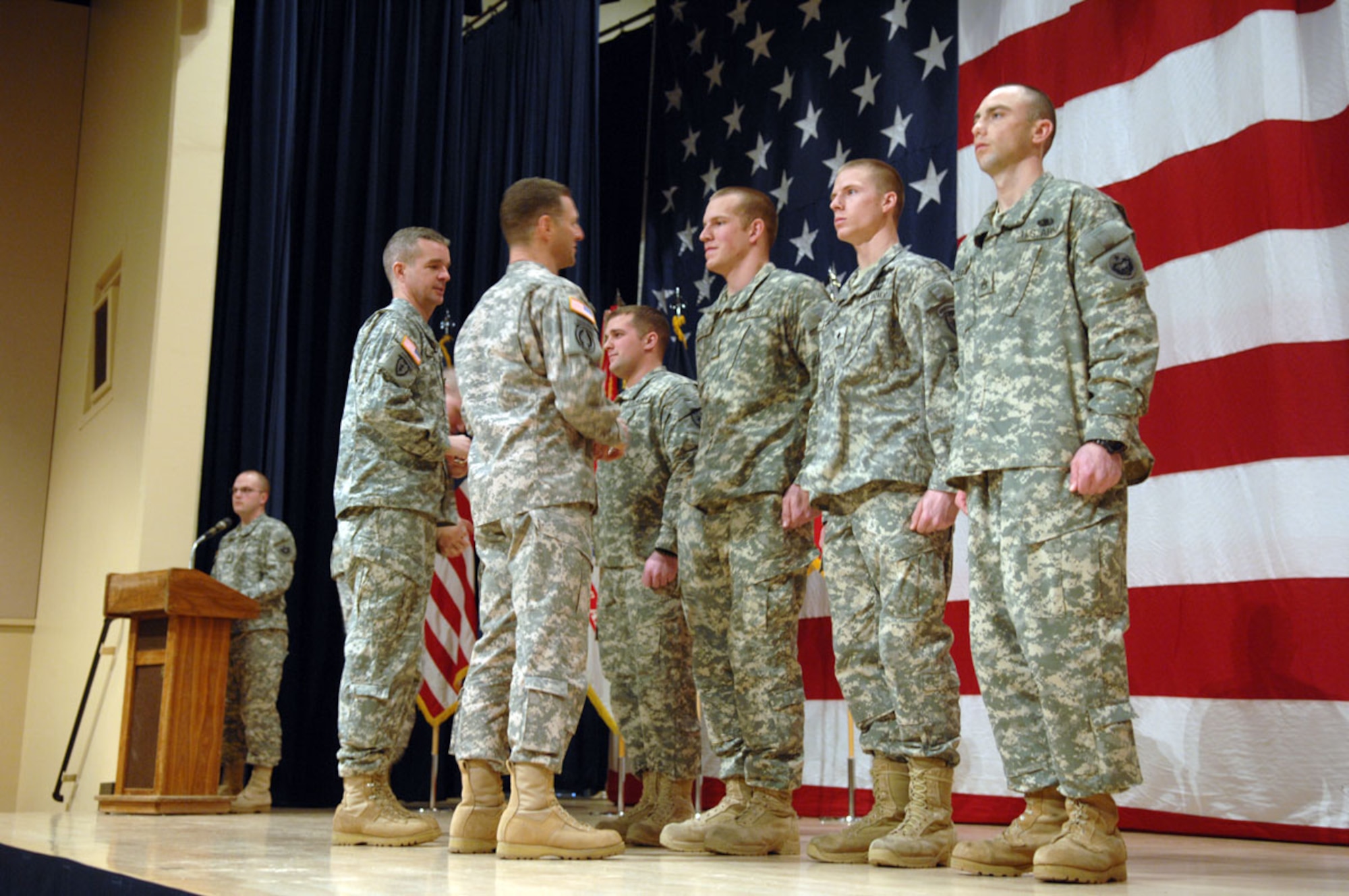 underBrig.
Gen. Raymond Palumbo, U.S. Army Alaska commandind general (center-left) and USARAK Command Sgt. Maj. David Turnbull (far left) congratulate awardees Jan. 28 at a Warrior Leader Course graduation ceremony on Joint Base Elmendorf-Richardson. From center-left, Distinguished Honor Graduate Spc. Jorge Webb; Distinguished Leadership Awardee Spc. Wesley Arrowood; Iron Warrior Awardee Sgt. Stevie A. Harman; and Instructor of the Cycle, Staff Sgt. Kevin D. Sawyer. (U.S. Army photo/SSgt. Matthew E. Winstead)