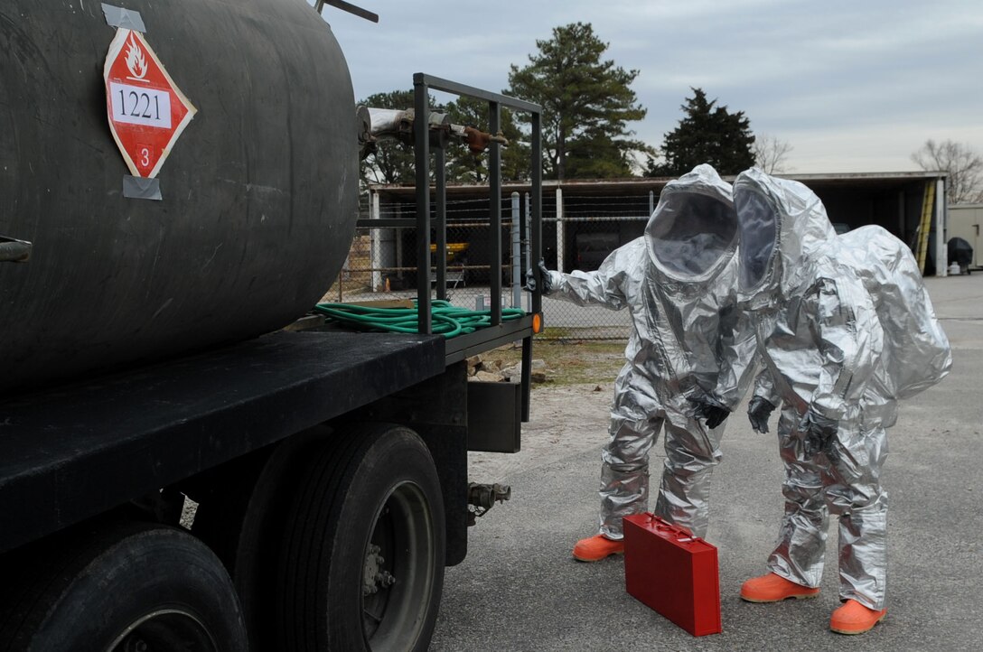 LANGLEY AIR FORCE BASE, Va. -- Staff Sgts. Douglas Collins and Michael Evans, 633d Civil Engineer Squadron Fire Department firefighters, respond to the scene of a mock chemical explosion to locate and repair a tank leak during a Major Accident Response Exercise Feb. 4. MAREs are held on a semi-annual basis to certify and train base emergency responders. (U.S. Air Force photo/Senior Airman Wesley Farnsworth) (RELEASED)