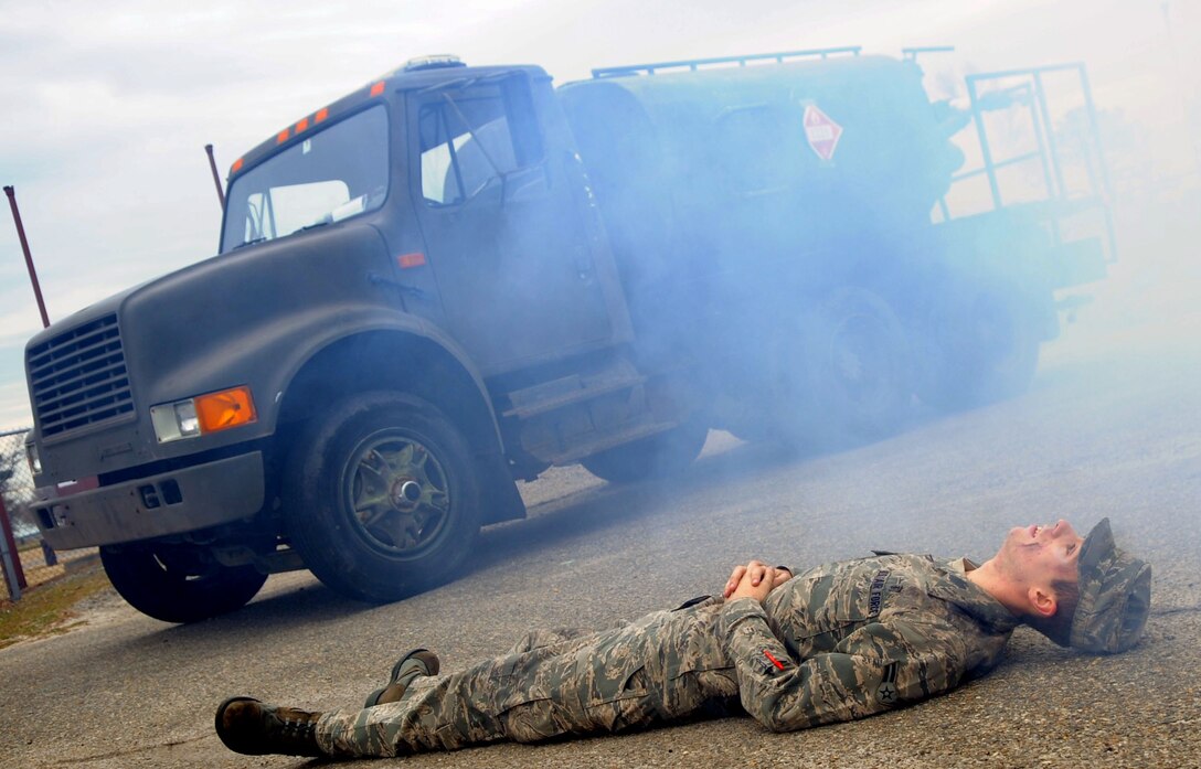 LANGLEY AIR FORCE BASE, Va. -- Airman 1st Class Seth Dillinger, 633d Medical Group Pharmacy technician, waits for emergency responders at the scene of a simulated explosion during a Major Accident Response Exercise Feb. 4. Airman Dillinger is one of many Airmen that volunteered to serve as “injured victims” during the MARE. (U.S. Air Force photo / Senior Airman Wesley Farnsworth) (RELEASED)