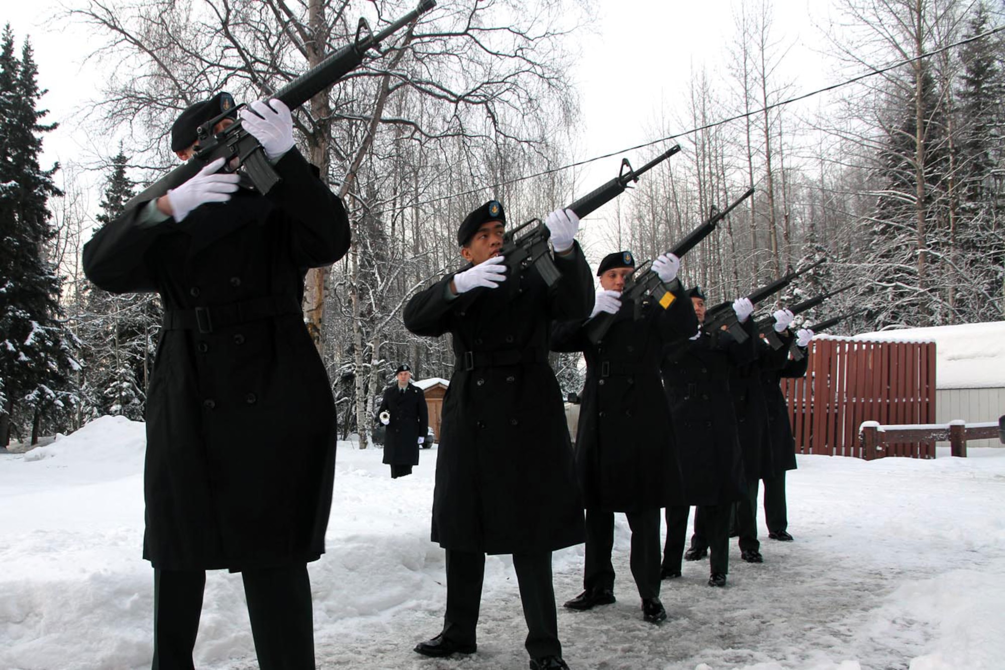 Soldiers from the 95th Chemical Company fire a 21-gun salute during a Jan. 28 memorial service for Pfc. Amy Sinkler at the JBER Soldiers’ Chapel. (U.S. Army photo/Staff Sgt. Jason Epperson)