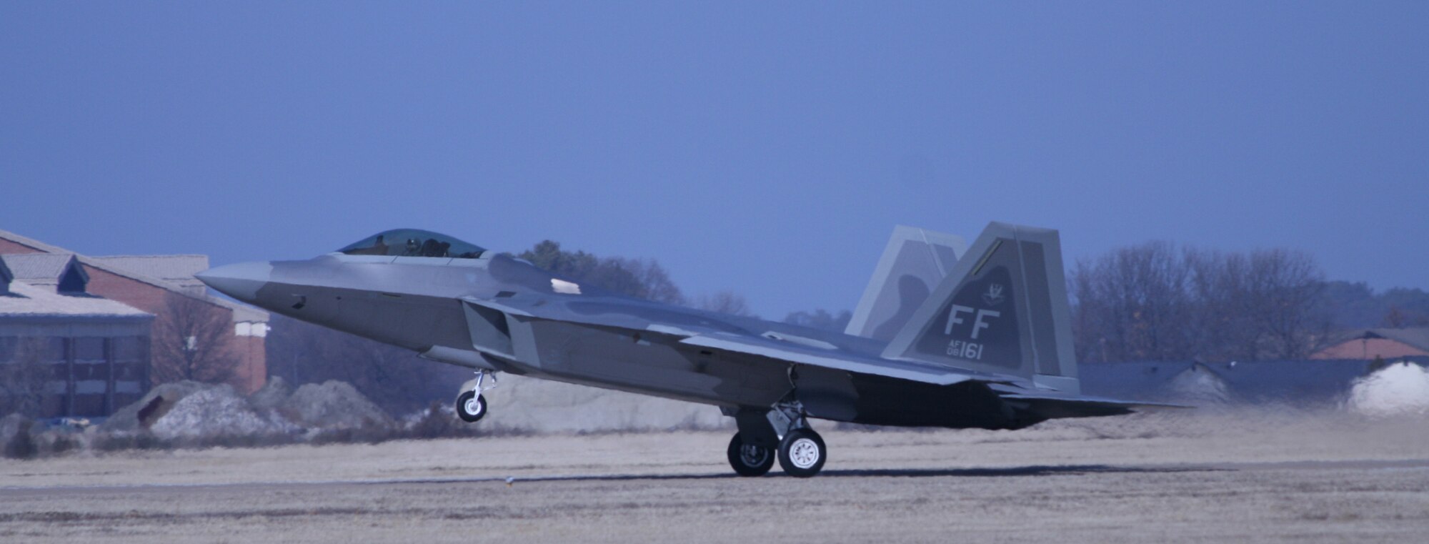 The F-22 Demonstration Team Raptor takes off from the runway of Langley Air Force Base, Va., Feb. 1, in preparation for the 2011 Air Combat Command aerial demo team certification. Once certified by the ACC commander, demo teams may begin showcasing their aircraft at various air shows across the nation. (U.S. Air Force photo by Scott Knuteson)
