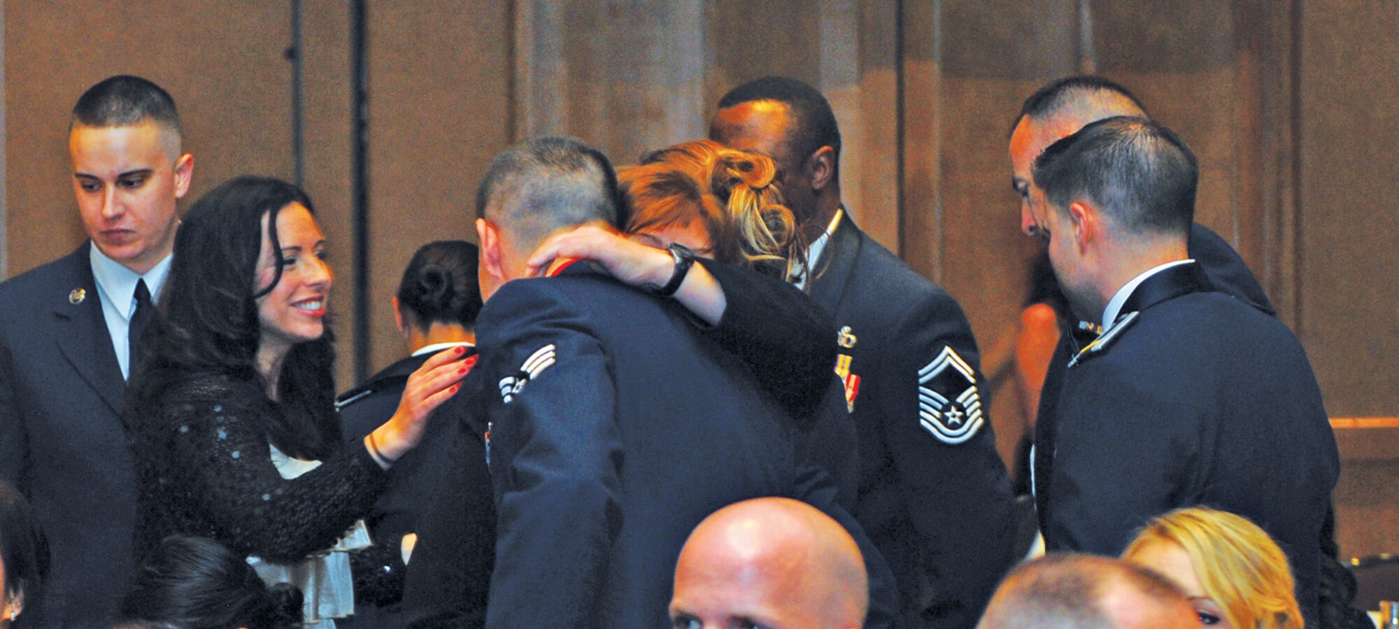 Members of the 56th Comptroller Squadron congratulate Senior Airman Shaun Houser, 56th Comptroller Squadron financial analyst, after winning the Airman of the Year category.  (U.S. Air Force photo/Senior Airman Tracie Forte)