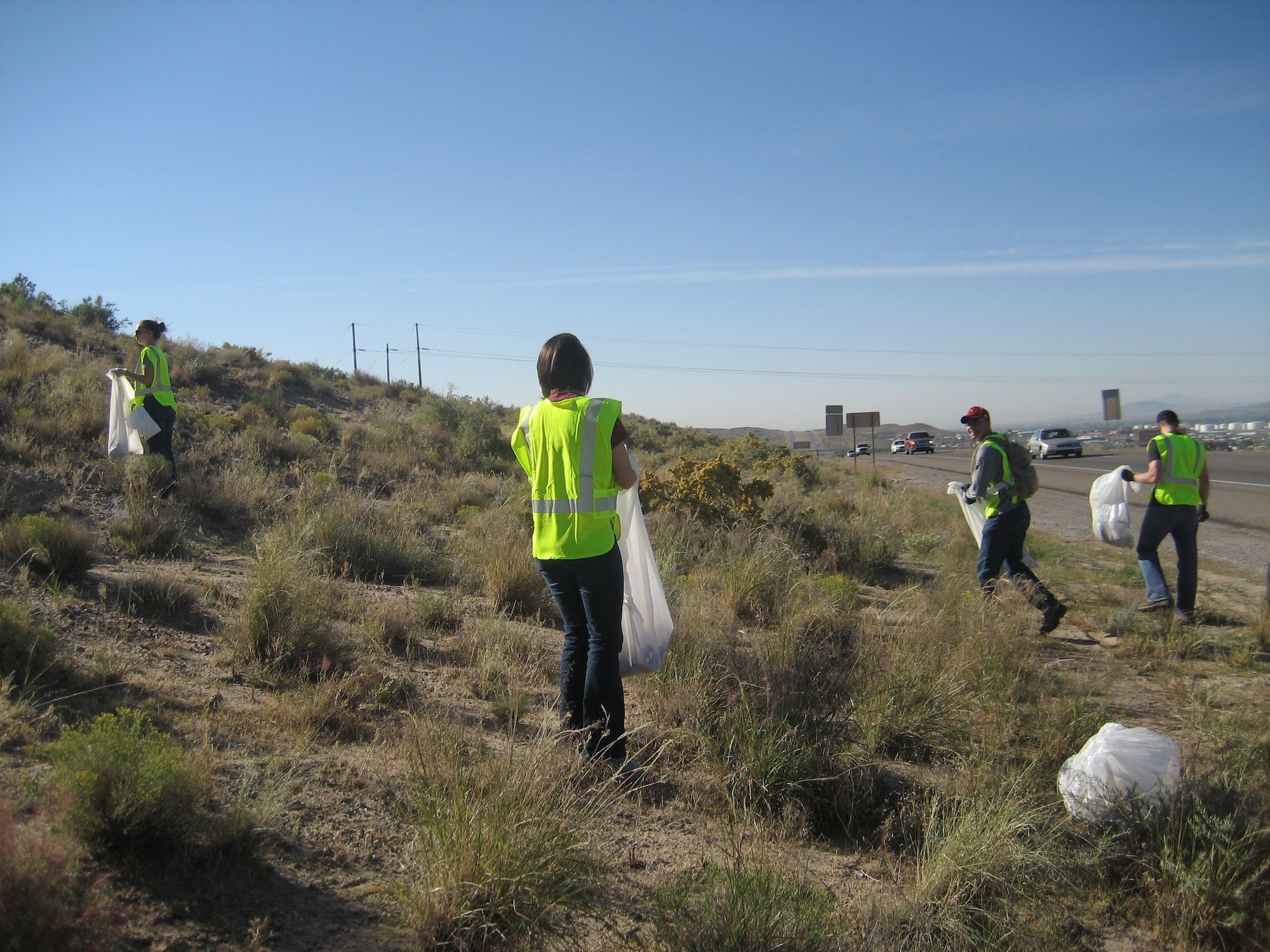 Members of the Company Grade Officers Council clean up trash on Interstate 25 as part of the Adopt-A-Highway program. U.S. Air Force Photo by Capt. Kristen Newsome