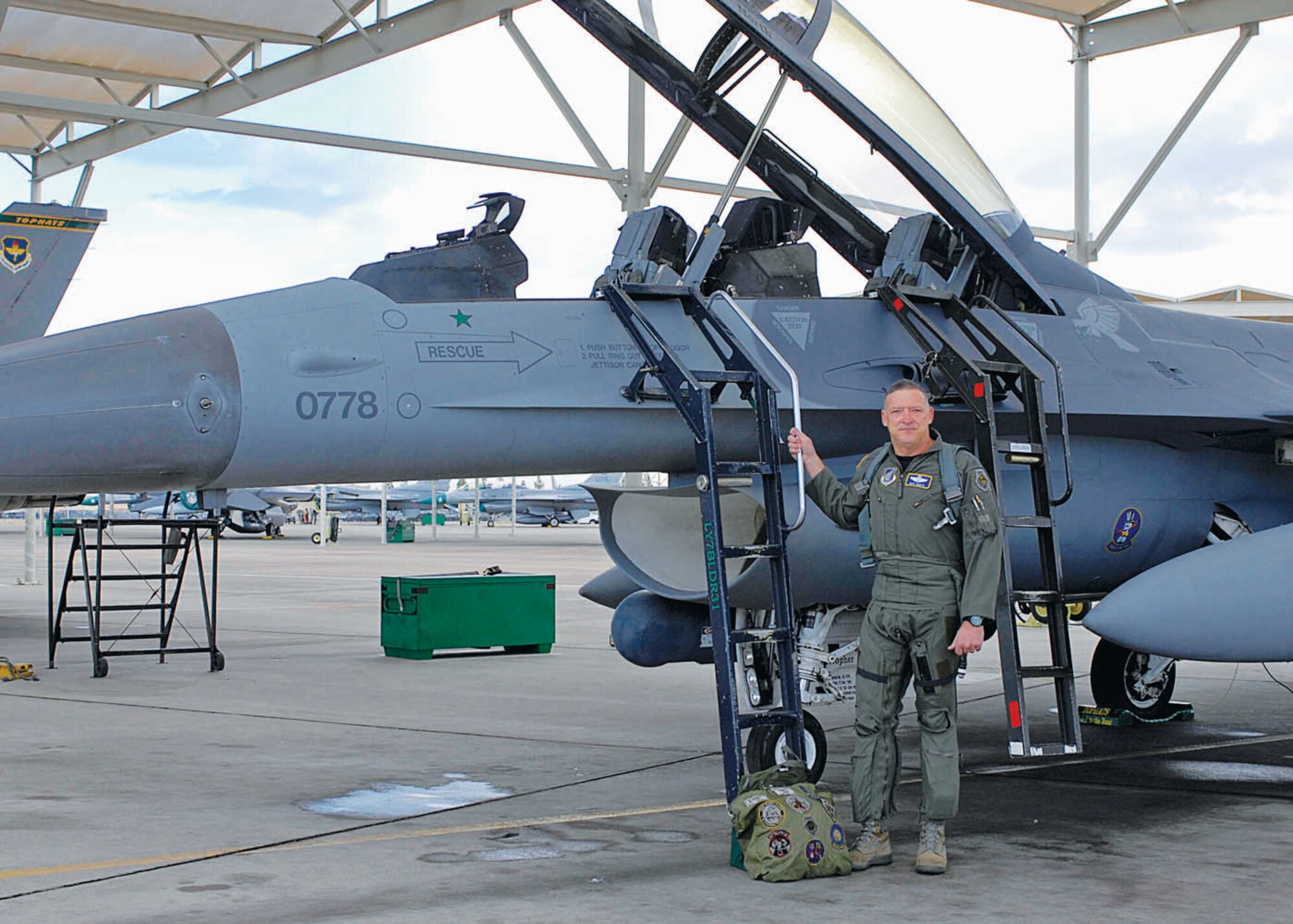 Gen. Gary North, Pacific Air Forces commander, poses for a photo in front of the F-16 he flew when he shot down an Iraqi MiG-25.  (U.S. Air Force photo/Senior Airman Darlene Seltmann)