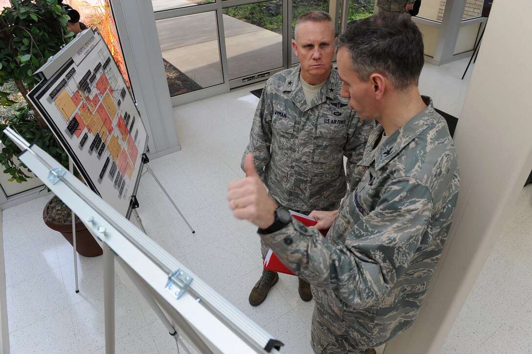LANGLEY AIR FORCE BASE, Va. – Brig. Gen. Daniel Wyman, Air Combat Command surgeon general, reviews the renovation plans for USAF Hospital Langley with Col. Eric Stone, 633d Air Base Wing medical group commander Feb. 3. General Wyman toured the base medical facilities to examine operations and highlight outstanding performers within the units. (U.S. Air Force photo/Senior Airman Antoinette Gibson) (RELEASED)