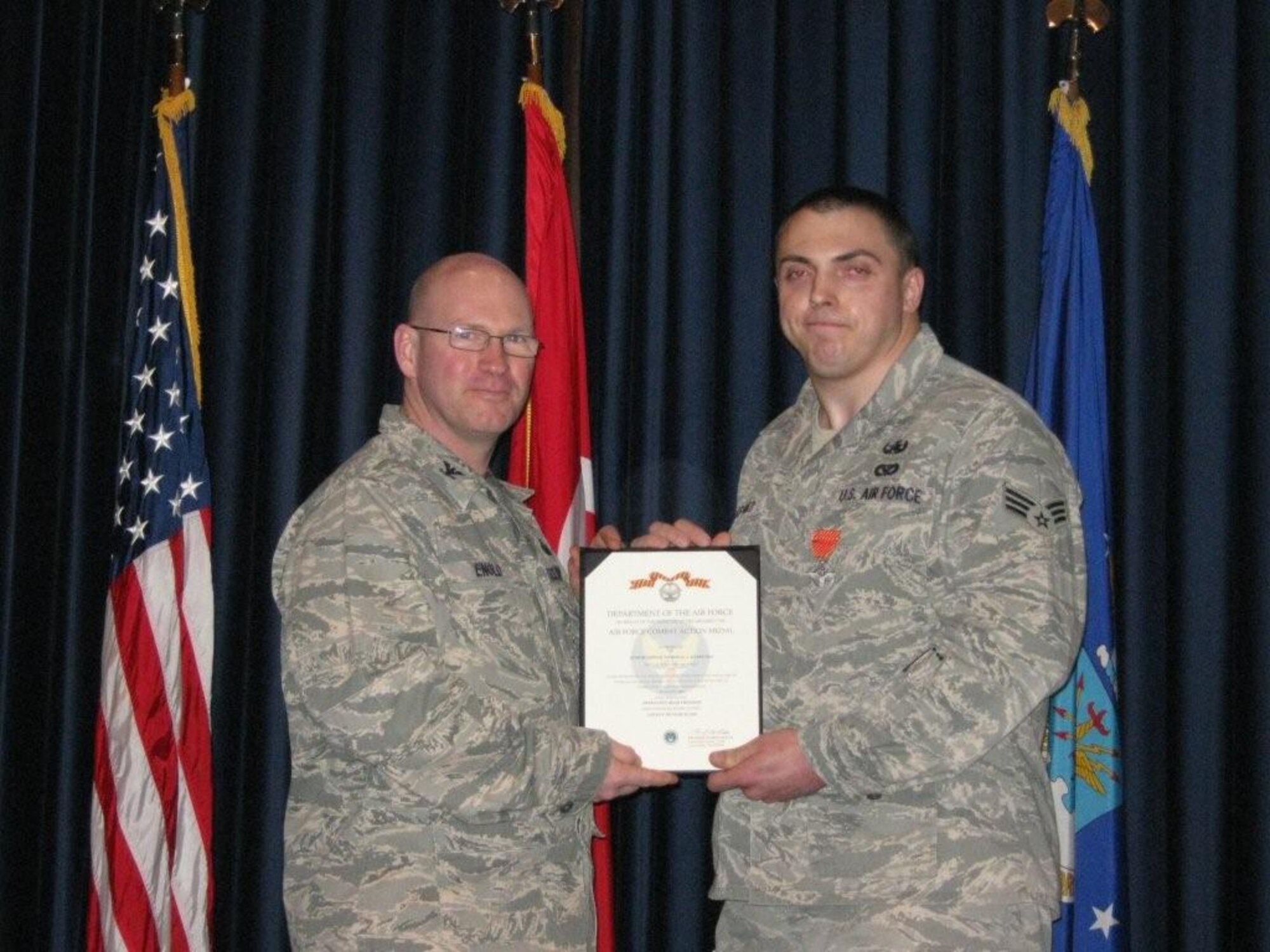 Senior Airman Nicholas Karpenko, 39th Civil Engineer Squadron, Explosive Ordnance Disposal flight, was presented the Air Force Combat Action Medal Jan. 13, at Incirlik Air Base, Turkey by Col. Scott Enold, the 39th Mission Support Group commander.  Airman Karpenko was awarded the medal  for his combat actions during a six-month deployment to Afghanistan.  The AFCAM is awarded to Airmen who have been involved in direct fighting situations where they risked their lives in an enemy engagement. (U.S. Air Force photo by Staff Sgt. Sean/Released)