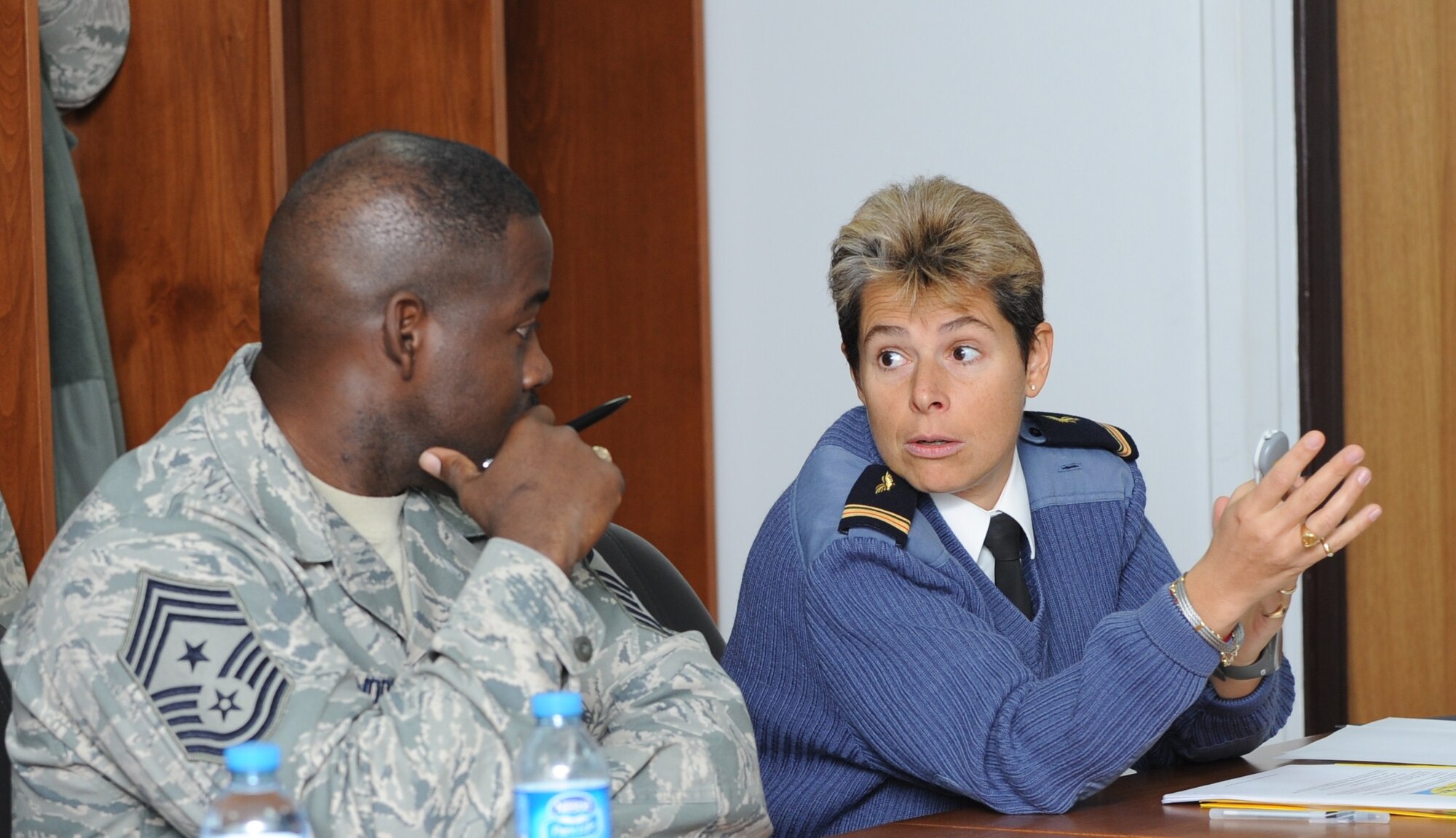 OR-9 Sandrine Vidal, of the French air force, talks to Chief Master Sgt. Marcus Snoddy, the 39th Air Base Wing command chief, during a professional development seminar held at Incirlik Jan. 28, 2011.  OR-9 Vidal is the senior enlisted leader at Allied Air Component Command Izmir.  (U.S. Air Force photo by Tech. Sgt. Valda Wilson/Released)