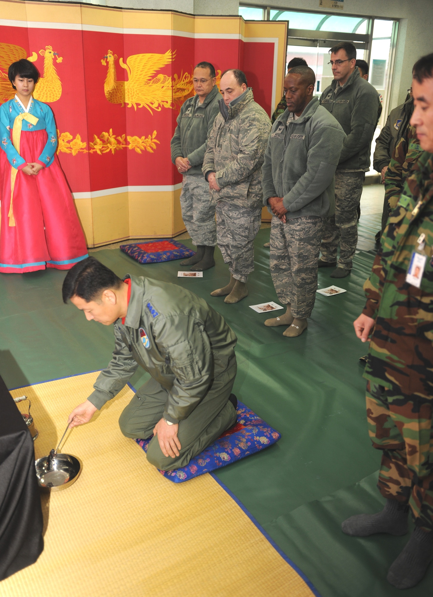 KUNSAN AIR BASE, Republic of Korea -- Col. Jung Sang-Hwa, Republic of Korea Air Force 38th Fighter Group commander, burns a letter to ancestors during a memorial service held during a Lunar New Year ceremony in the ROKAF base exchange Feb. 3. The combined 8th Fighter Wing and ROKAF 38th FG ceremony included the memorial service, ceremonial bowing, a traditional Korean breakfast and traditional games. (U.S. Air Force photo/Senior Airman Ciara Wymbs)