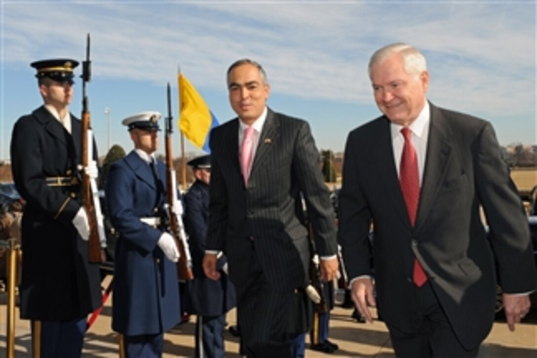 Secretary of Defense Robert M. Gates (right) escorts Colombian Defense Minister Rodrigo Rivera through an honor cordon and into the Pentagon on Feb. 3, 2011.  Gates and Rivera will meet to discuss a broad range of mainly regional security issues.  