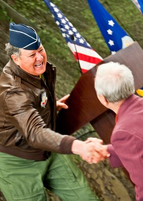 Brig. Gen. (ret) Douglas Richardson, presents Art Dees, former 53rd Wing honorary commander, with a coin after finding out he was born on the exact day as the wing was activated during the wing’s 70th birthday celebration Feb. 3 at Eglin Air Force Base, Fla.   General Richardson was commander of the 53rd Wing from 1998 to 2000.  The wing was activated Jan. 15, 1941.  (U.S. Air Force photo/Samuel King Jr.)