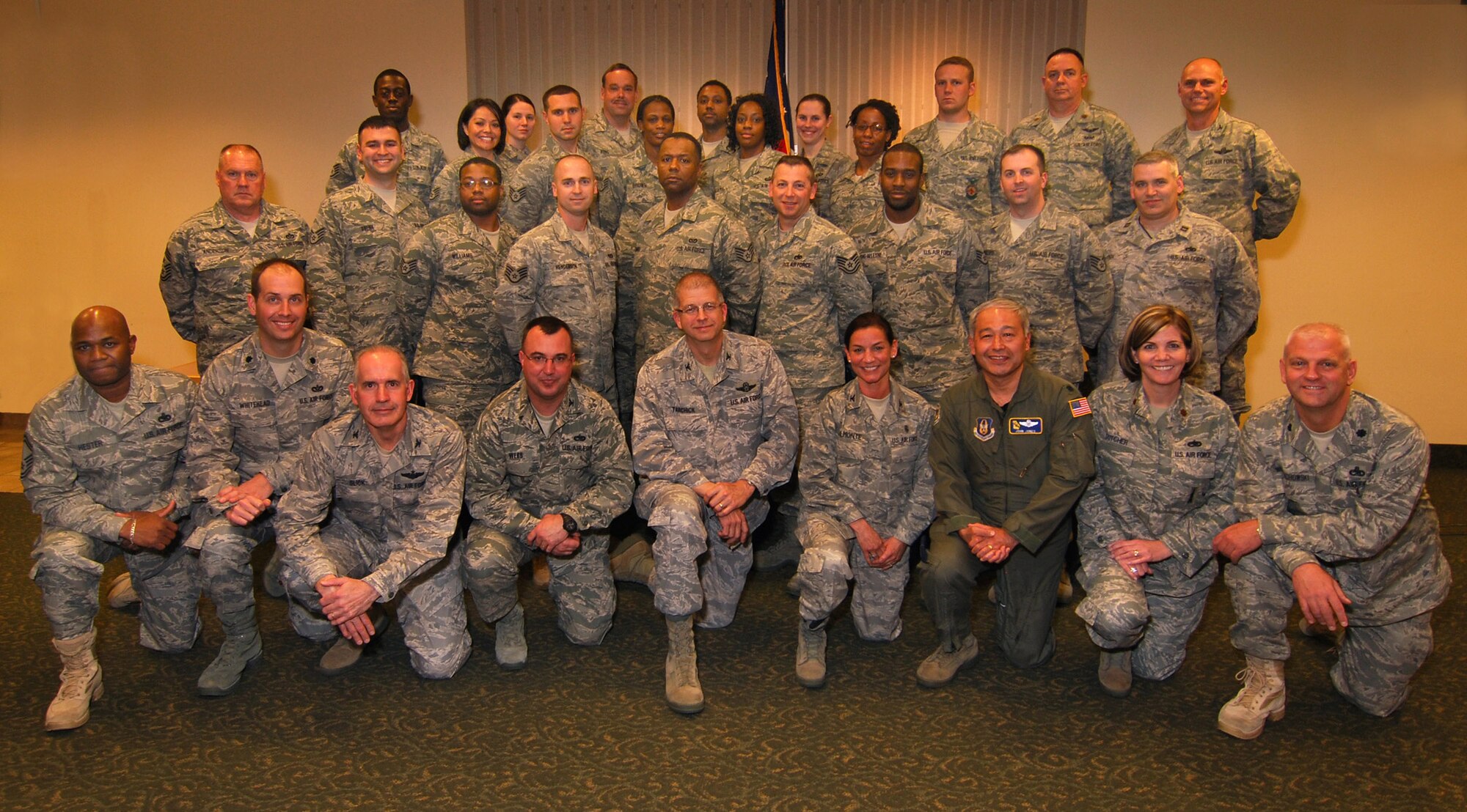 FY11-02 NCO Leadership & Development Course graduates celebrate with a class group photo along with 94th Airlift Wing leadership, 4 Feb.  (U.S. Air Force photo/ Brad Fallin)
