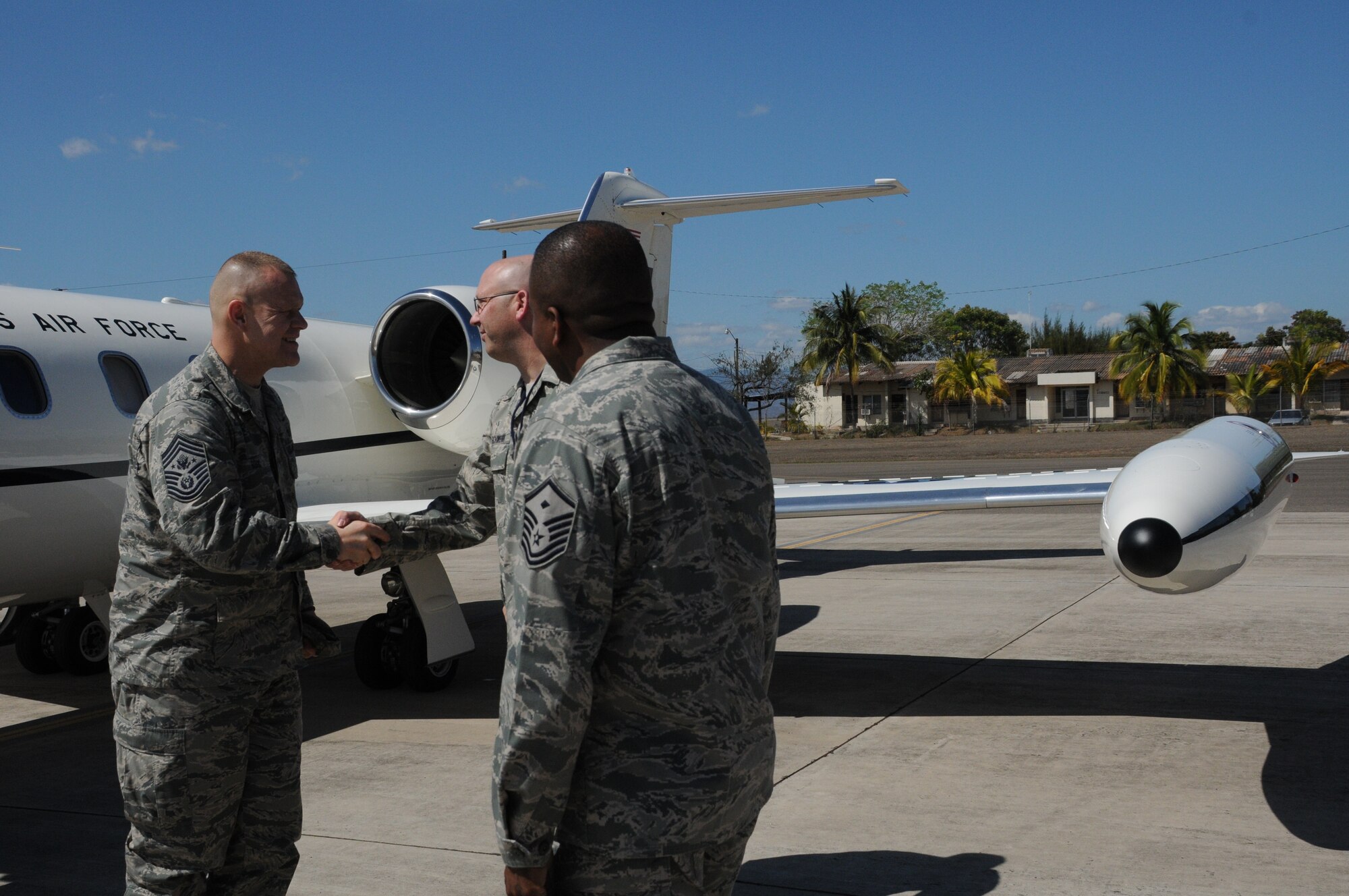 SOTO CANO AIR BASE, Honduras -- Chief Master Sgt. of the Air Force James Roy is greeted to Soto Cano Air Base Jan. 30 by the 612th Air Base Squadron Senior Enlisted Leader, Chief Master Sgt. Thomas Schwenk and the 612th ABS first sergeant, Master Sgt. Emmit Bartee. During Chief Roy's visit to Soto Cano, he toured many facilities, conducted meet-and-greets and spoke with Airmen about key focuses in the Air Force today. (U.S. Air Force photo/Staff Sgt. Kimberly Rae Moore)